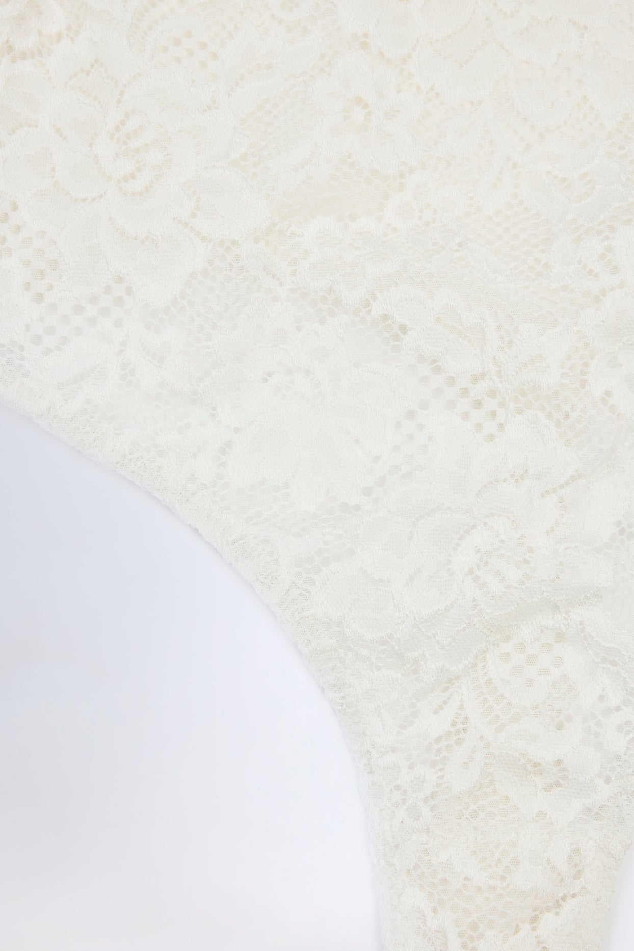 Oh Polly's Roberta wearing the Zayla Bodysuit in White Stretch Lace fabric perfect for holiday getaways