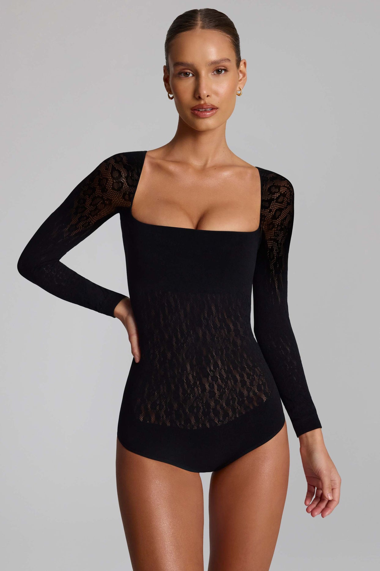 Cap-Sleeve Seamless Knit Bodysuit in Black