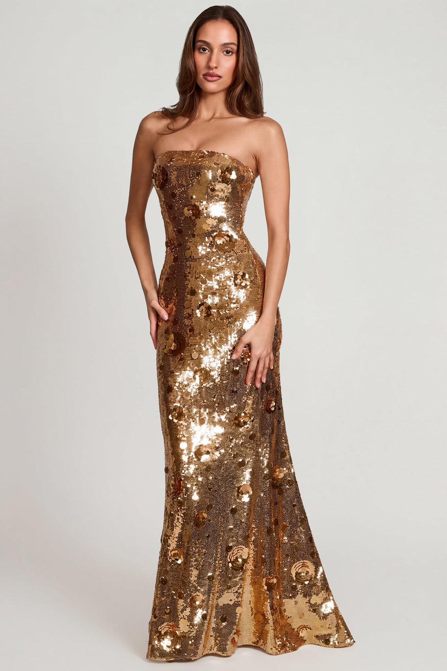 Oh Polly's Yasmin wearing the Nottola Gown Length Dress in Gold Flower Sequin sequin floral fabric perfect for upscale cocktail parties