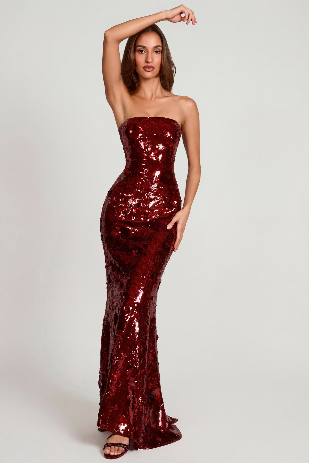 Oh Polly's Yasmin wearing the Nottola Gown Length Dress in Red Flower Sequin sequin floral fabric perfect for a romantic dinner date