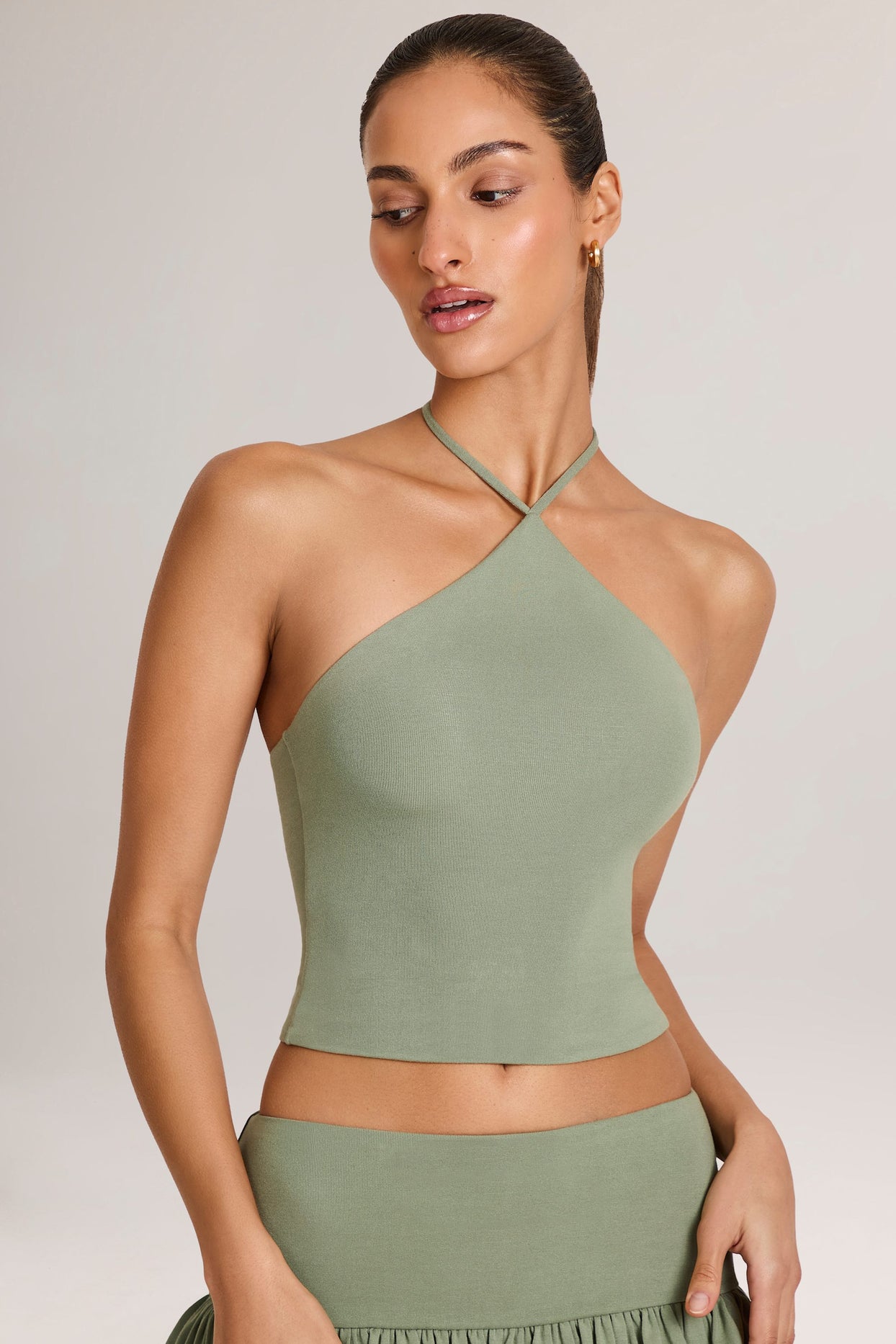 Oh Polly model Yasmin wearing the Aviora Full Top in Sage Green Modal fabric perfect for brunch with friends
