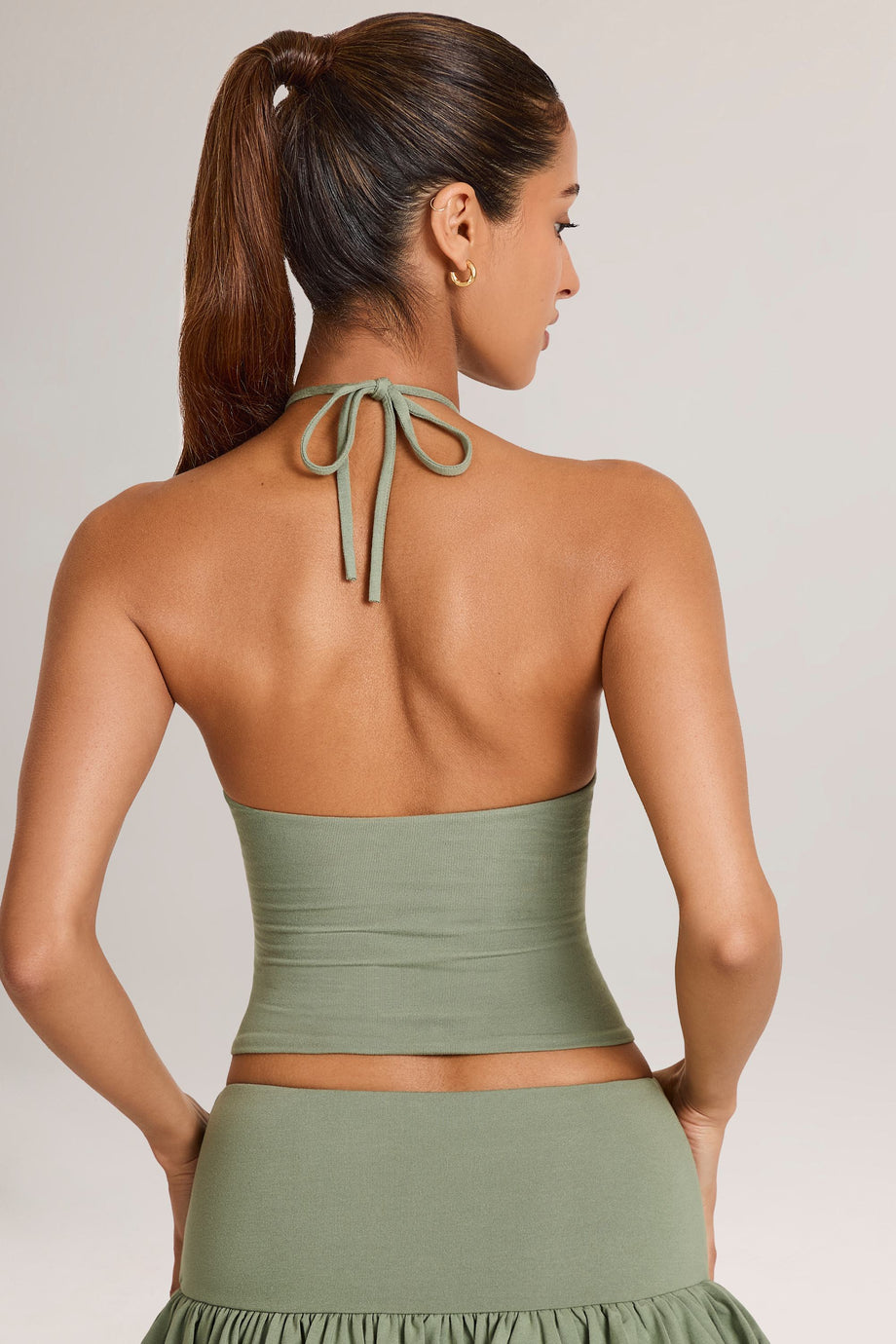 Oh Polly model Yasmin wearing the Aviora Full Top in Sage Green Modal fabric perfect for summer date night