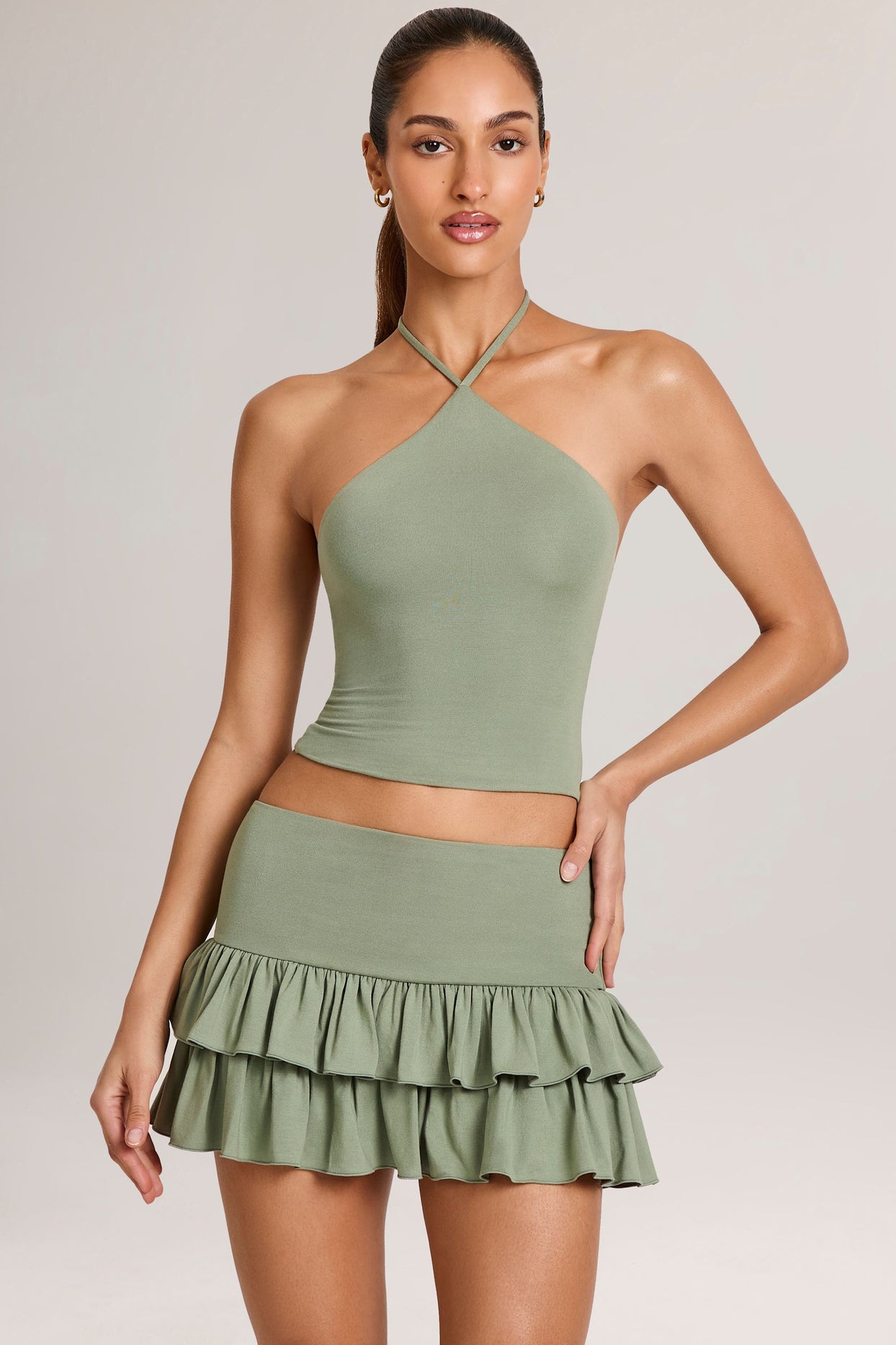 Oh Polly model Yasmin wearing the Aviora Full Top in Sage Green Modal fabric perfect for garden party events