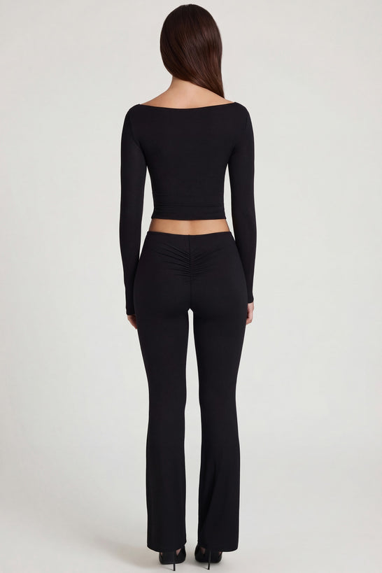 Oh Polly's Roberta wearing the Vevina Regular Trousers in Black Modal fabric perfect for dinner dates