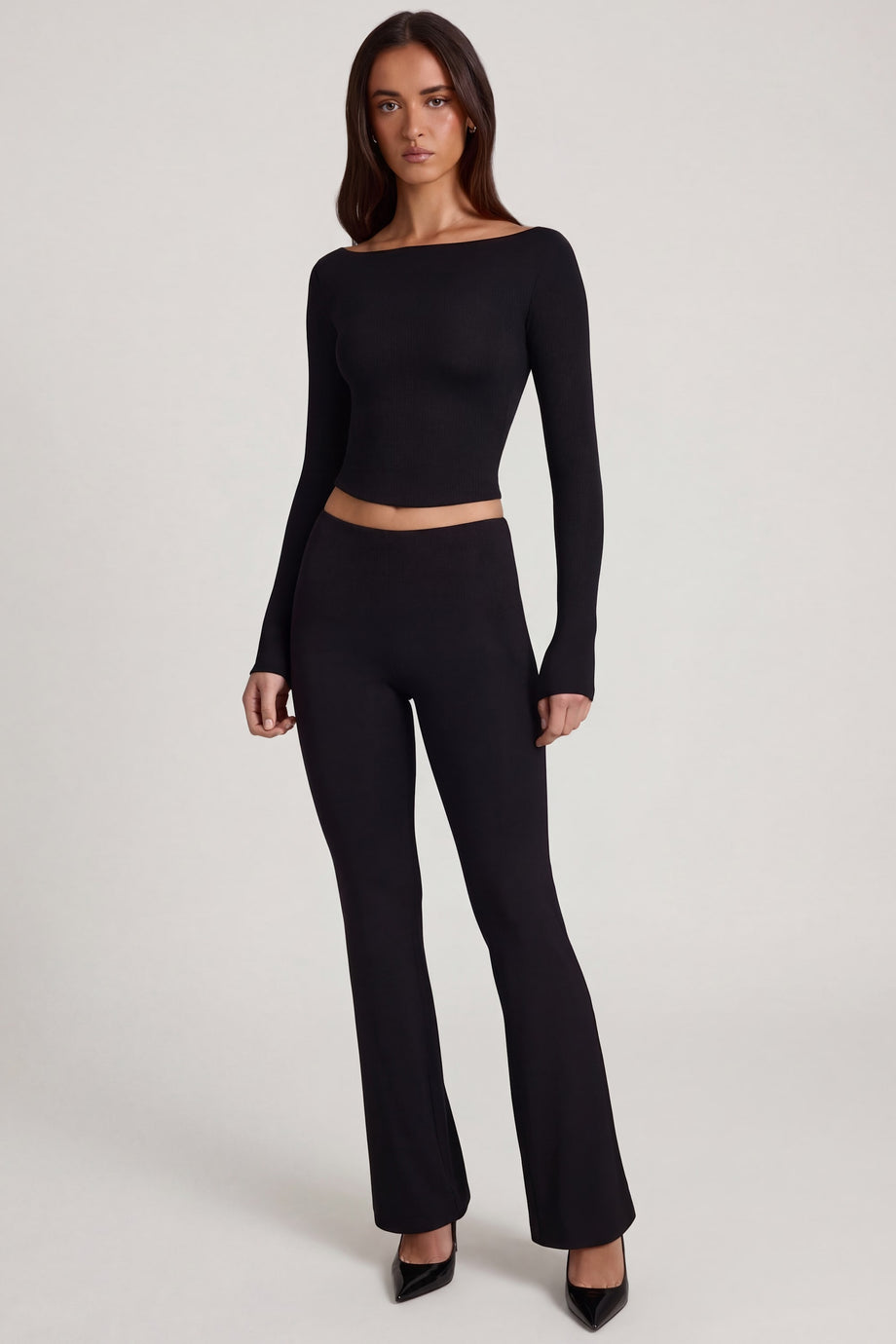 Oh Polly's Roberta wearing the Vevina Regular Trousers in Black Modal fabric perfect for evening events