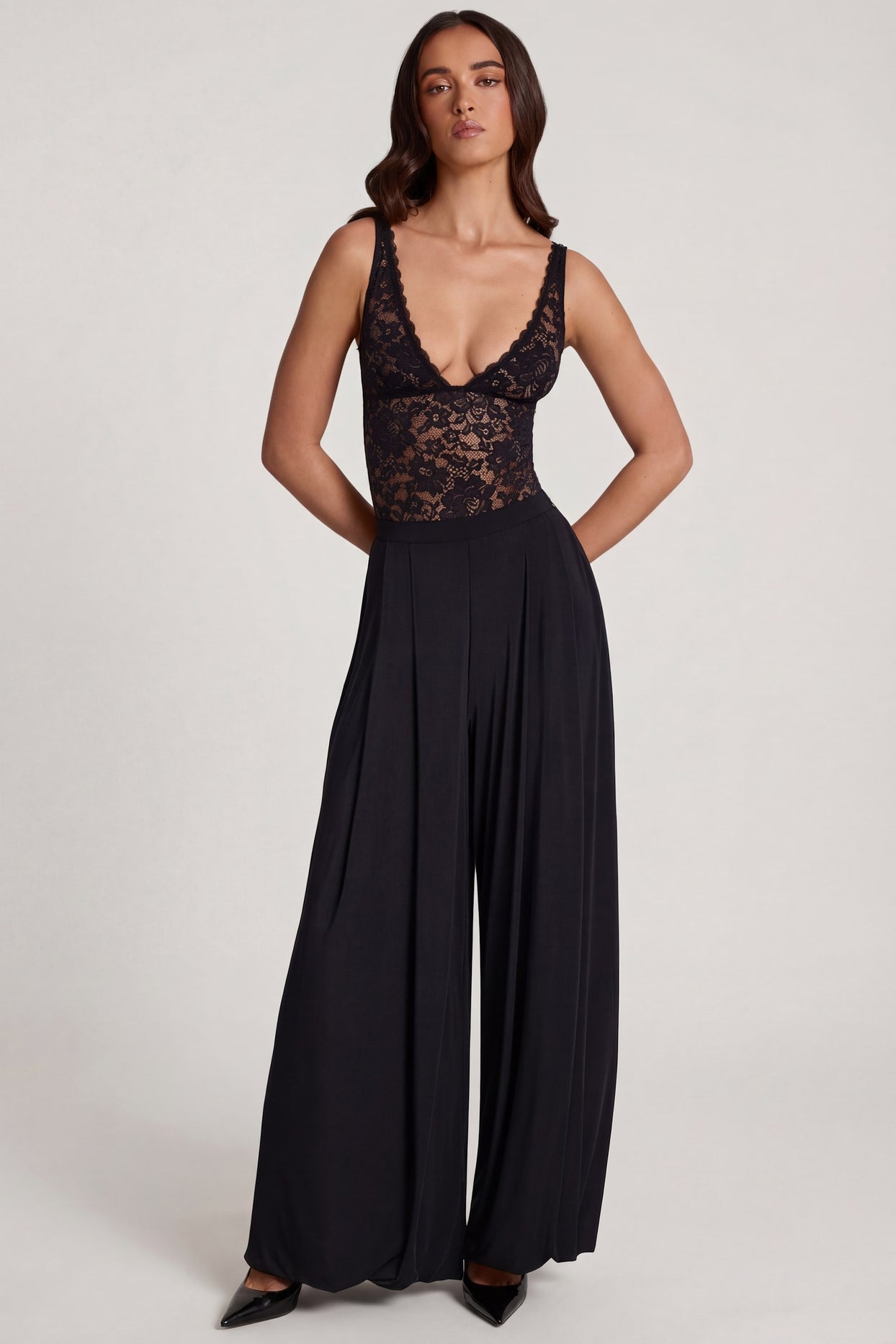 Oh Polly's Roberta wearing the Zafira Regular Trousers in Black Sheer Jersey fabric perfect for a night out