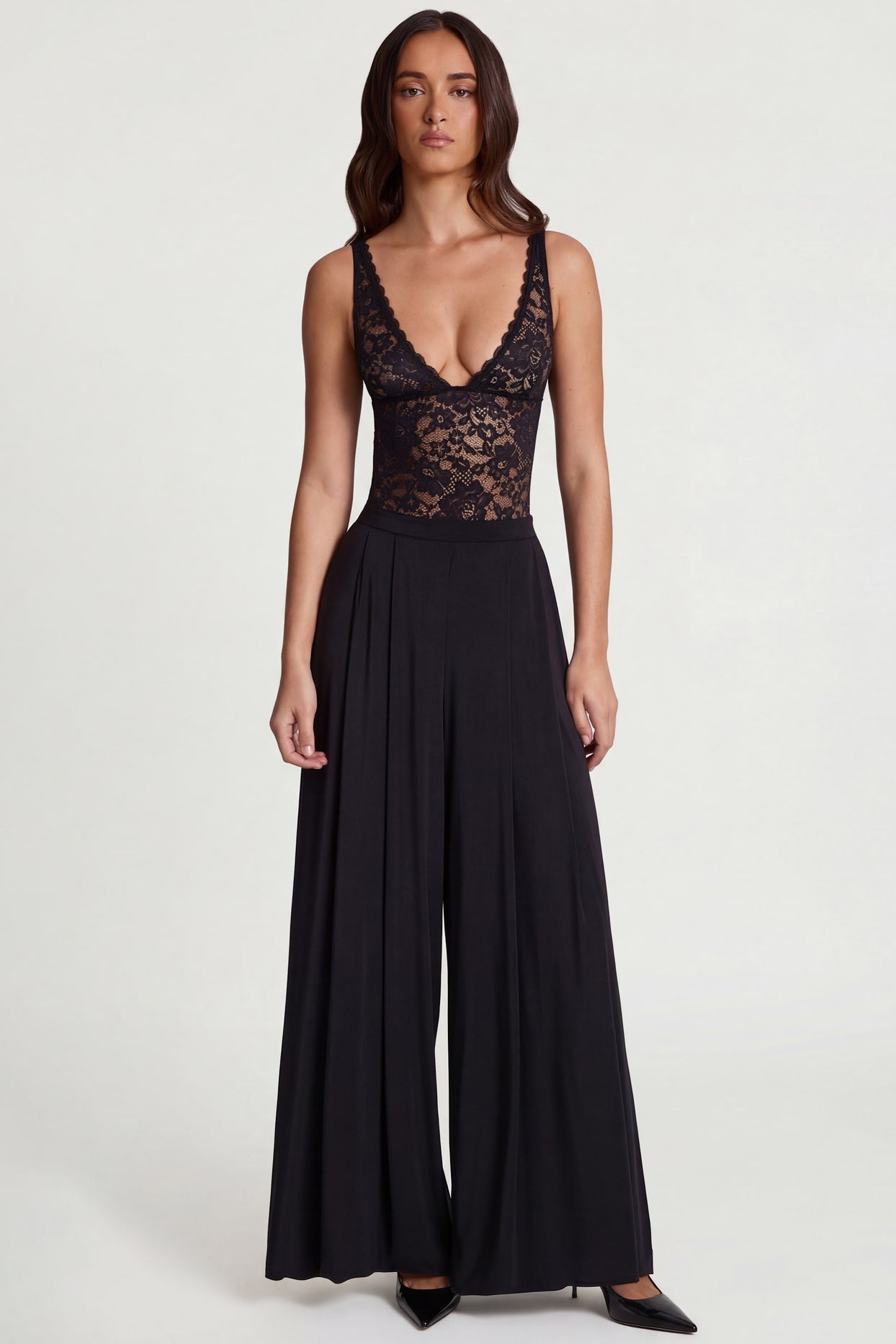 Oh Polly's Roberta wearing the Zafira Regular Trousers in Black Sheer Jersey fabric perfect for rooftop parties