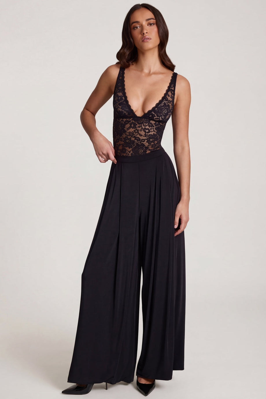 Oh Polly's Roberta wearing the Zafira Regular Trousers in Black Sheer Jersey fabric perfect for cocktail evenings