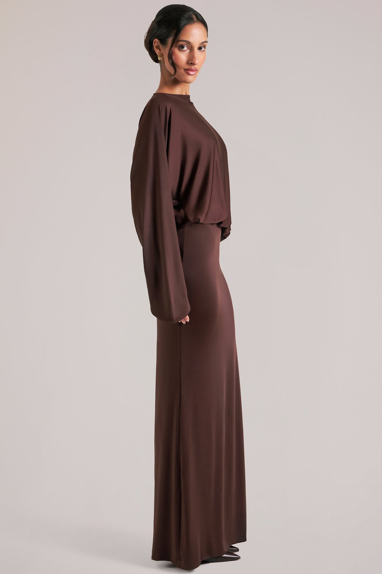 Oh Polly model Yasmin wearing the Lani Maxi Dress in Chocolate Brown Soft Jersey fabric perfect for cocktail parties