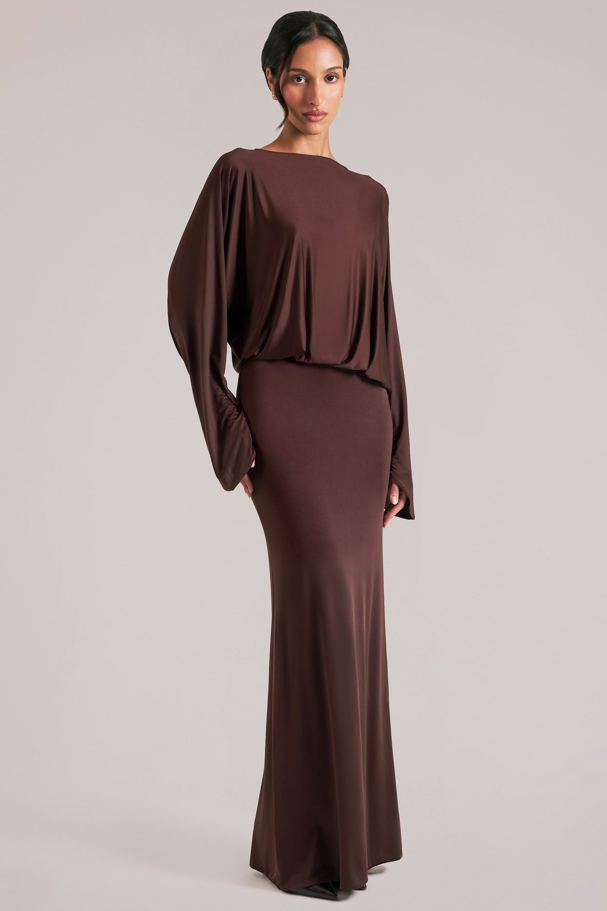 Oh Polly model Yasmin wearing the Lani Maxi Dress in Chocolate Brown Soft Jersey fabric perfect for holiday gatherings