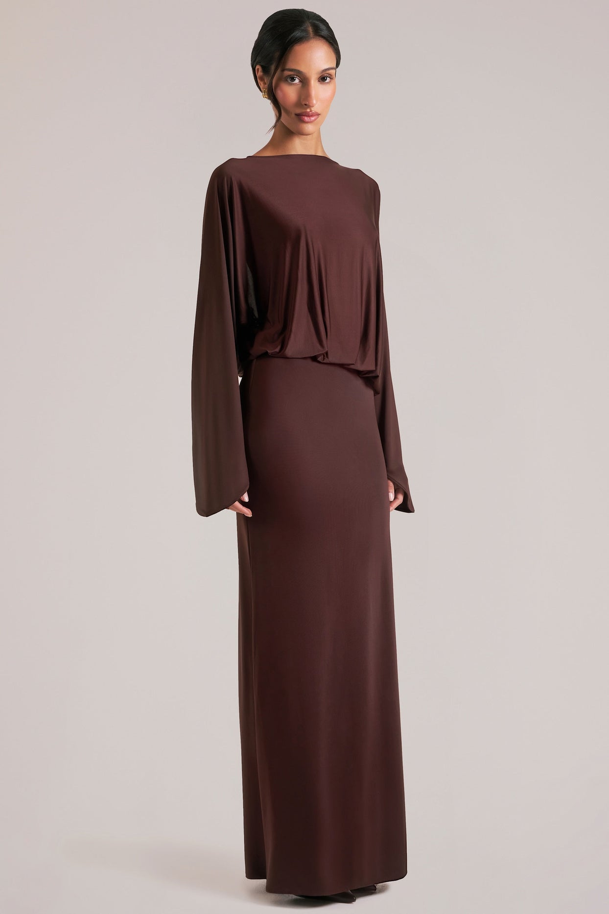 Oh Polly model Yasmin wearing the Lani Maxi Dress in Chocolate Brown Soft Jersey fabric perfect for wedding guests