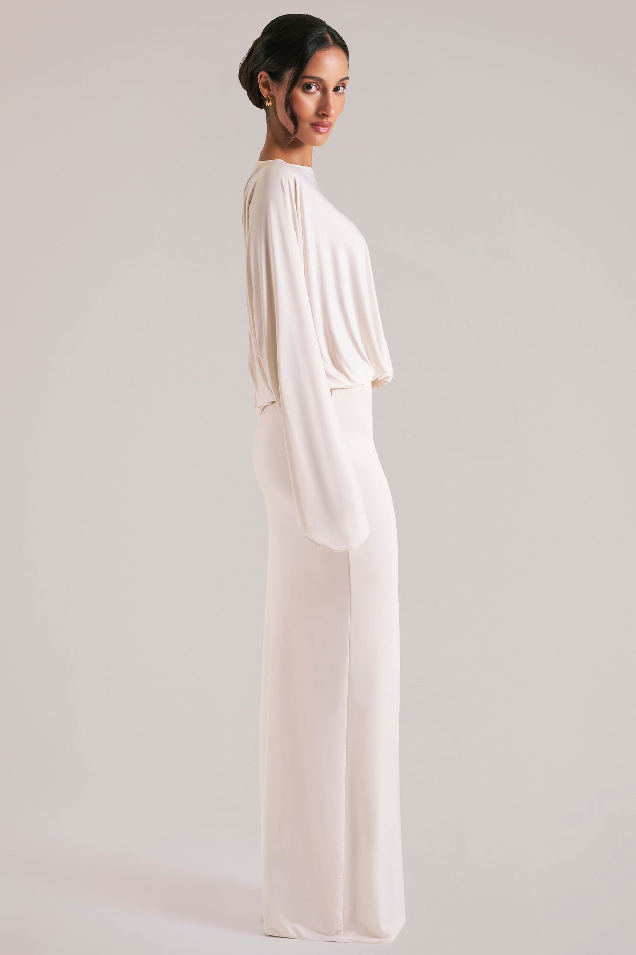 Oh Polly model Yasmin wearing the Lani Maxi Dress in Ivory Soft Jersey fabric perfect for romantic date nights