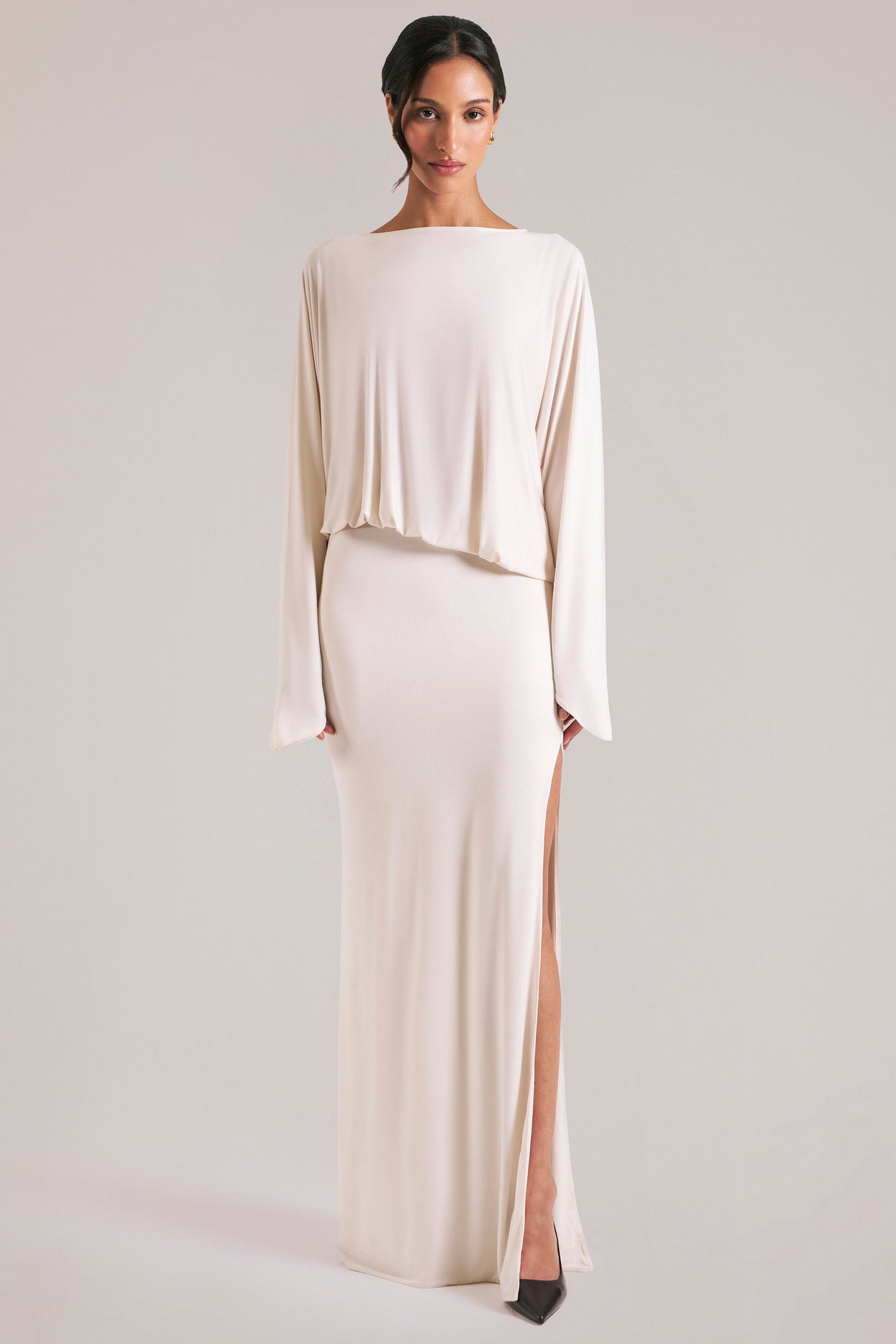 Oh Polly model Yasmin wearing the Lani Maxi Dress in Ivory Soft Jersey fabric perfect for holiday getaways