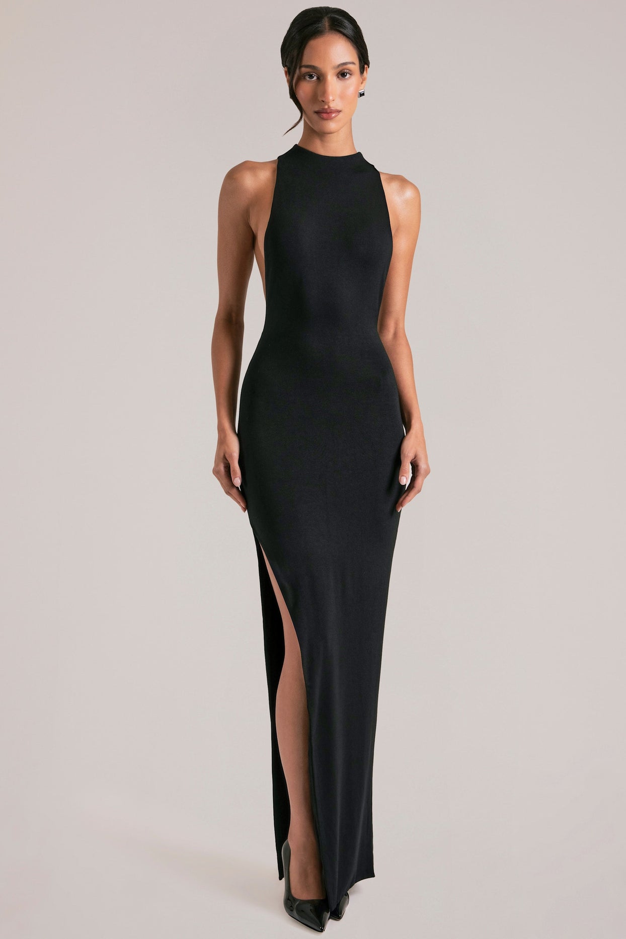 Oh Polly model Yasmin wearing the Mayda Maxi Dress in Black Soft Jersey fabric perfect for wedding guests