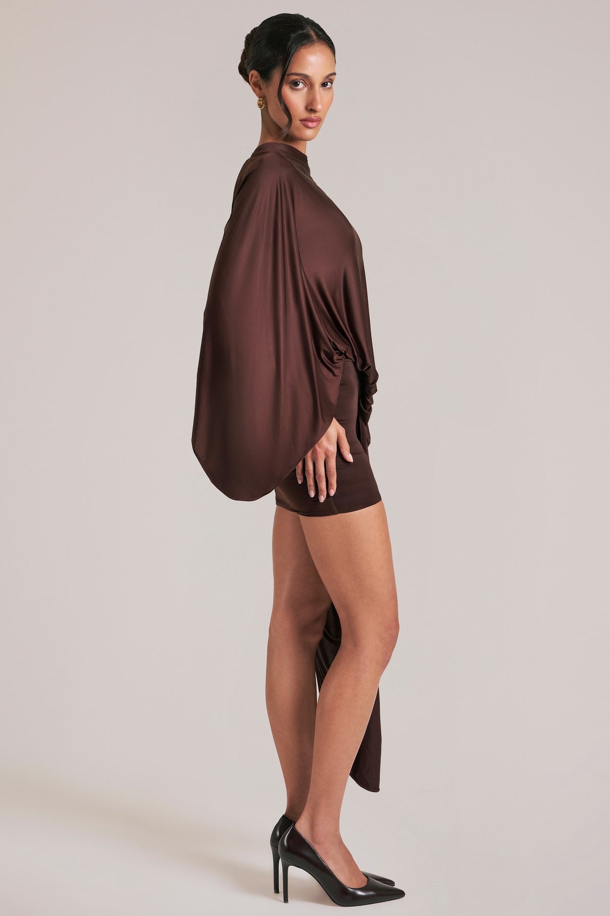 Oh Polly model Yasmin wearing the Lida Mini Dress in Chocolate Brown Satin fabric perfect for evening events