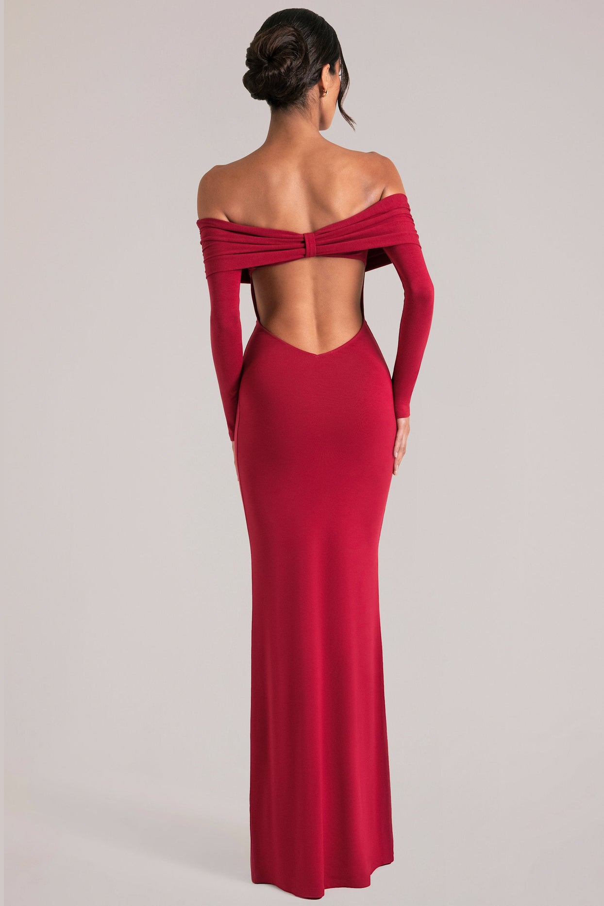 Oh Polly model Yasmin wearing the Depny Maxi Dress in Cherry Red Modal fabric perfect for summer weddings