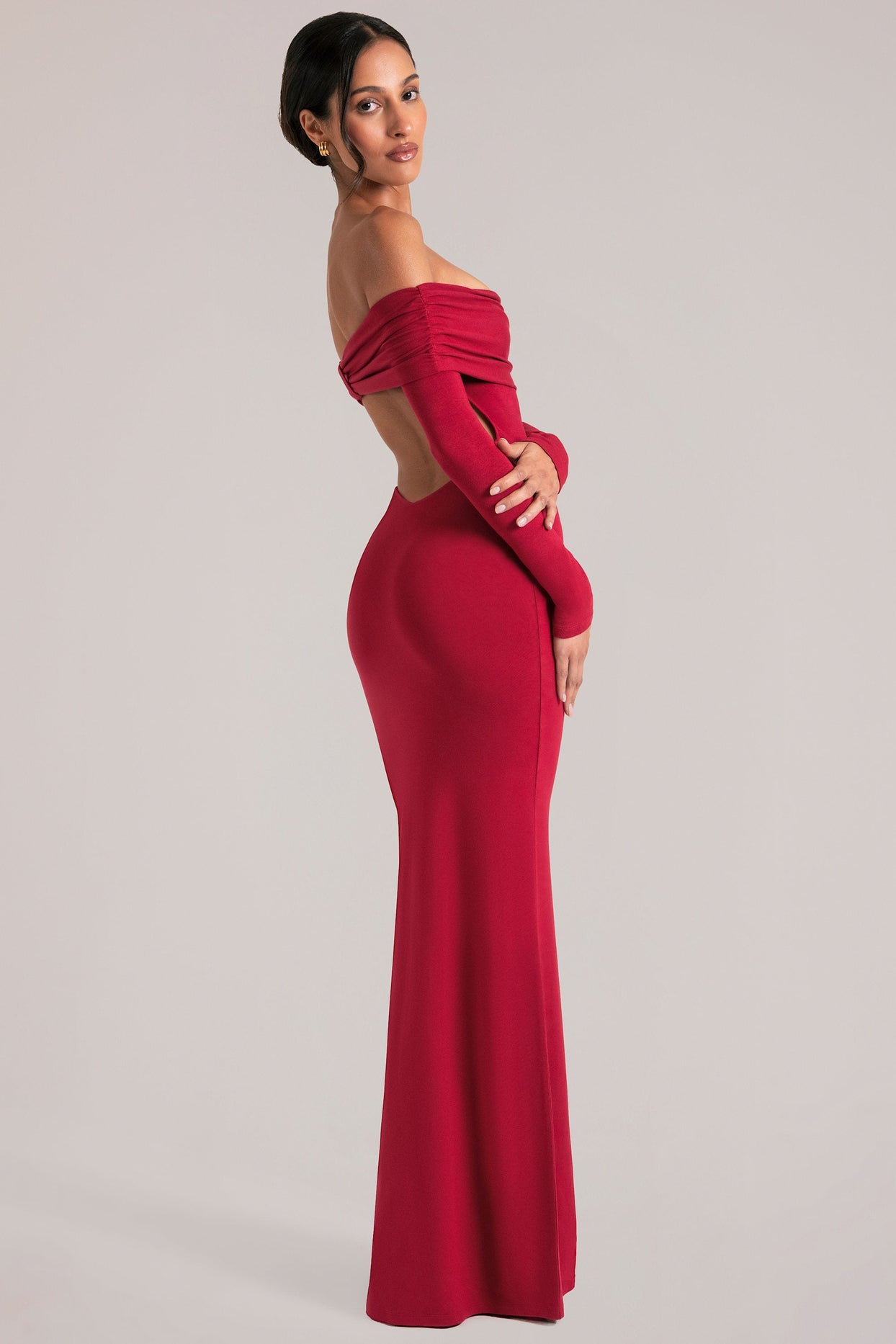 Oh Polly model Yasmin wearing the Depny Maxi Dress in Cherry Red Modal fabric perfect for summer weddings