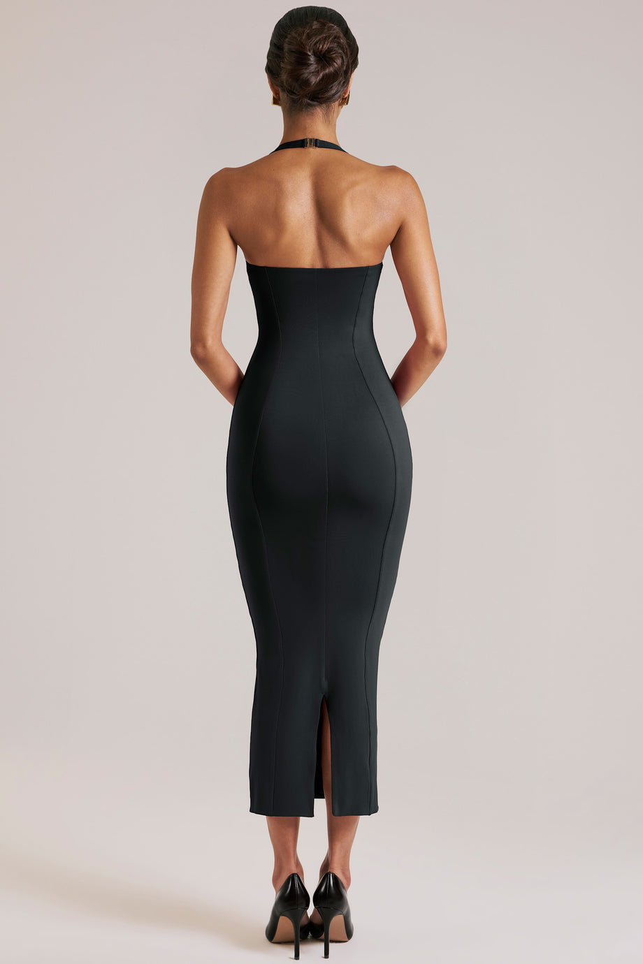 Oh Polly model Yasmin wearing the Landen Midi Dress in Black Modal fabric perfect for cocktail parties