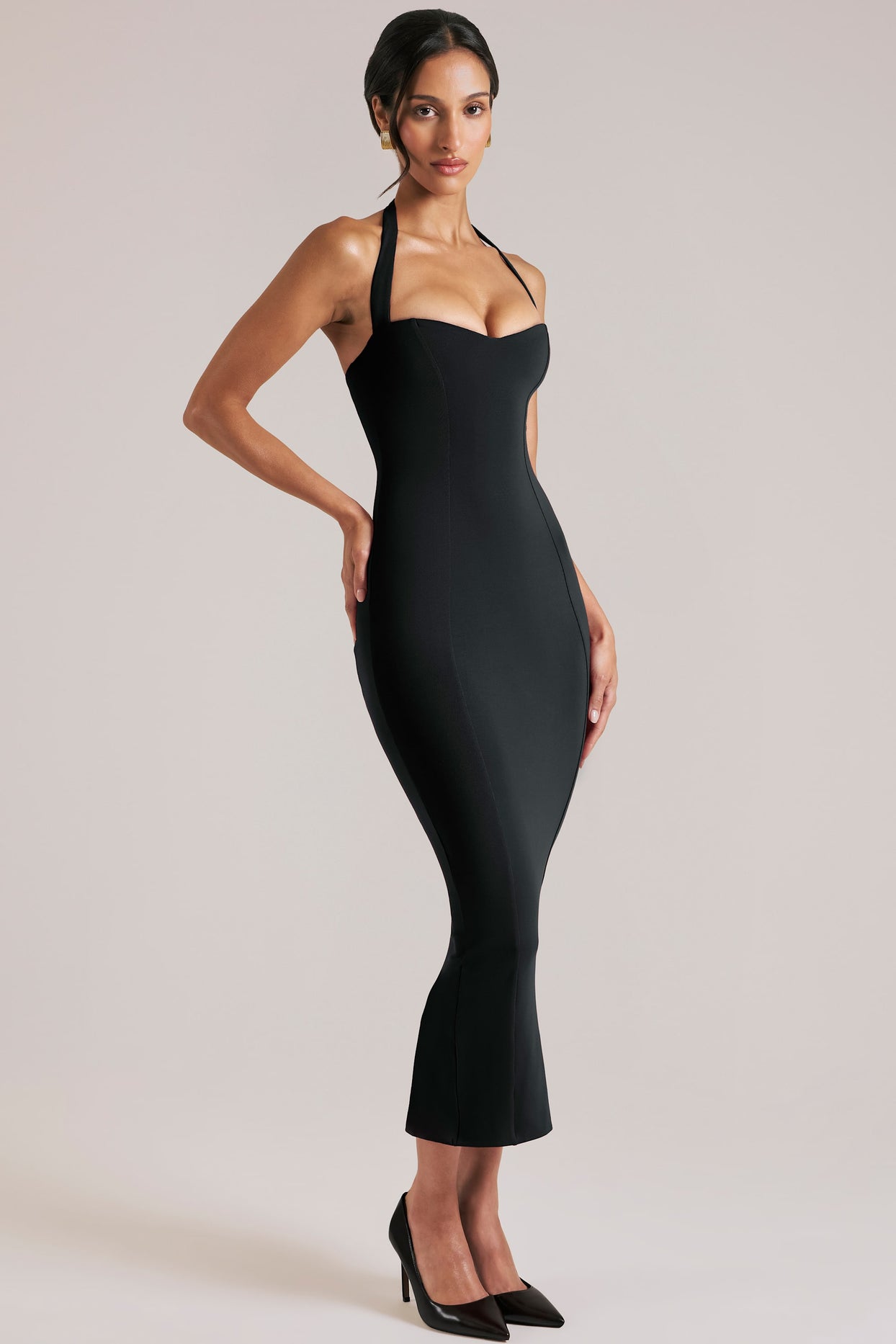 Oh Polly model Yasmin wearing the Landen Midi Dress in Black Modal fabric perfect for wedding guests