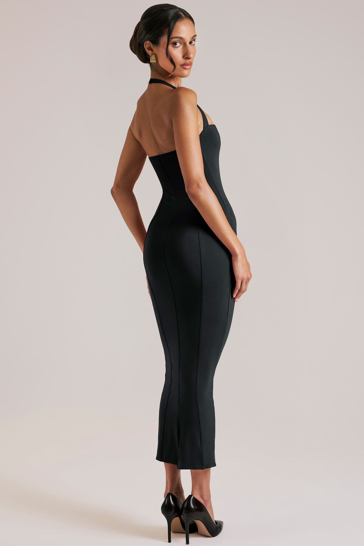 Oh Polly model Yasmin wearing the Landen Midi Dress in Black Modal fabric perfect for special occasions