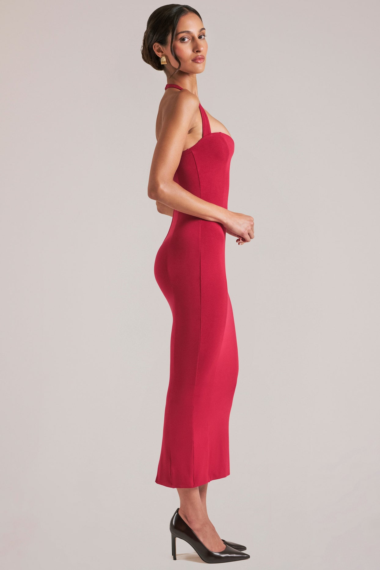 Oh Polly model Yasmin wearing the Landen Midi Dress in Cherry Red Modal fabric perfect for evening dinner out