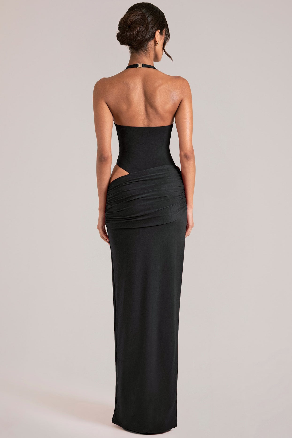 Oh Polly model Yasmin wearing the Oona Maxi Dress in Black Modal fabric perfect for cocktail party nights