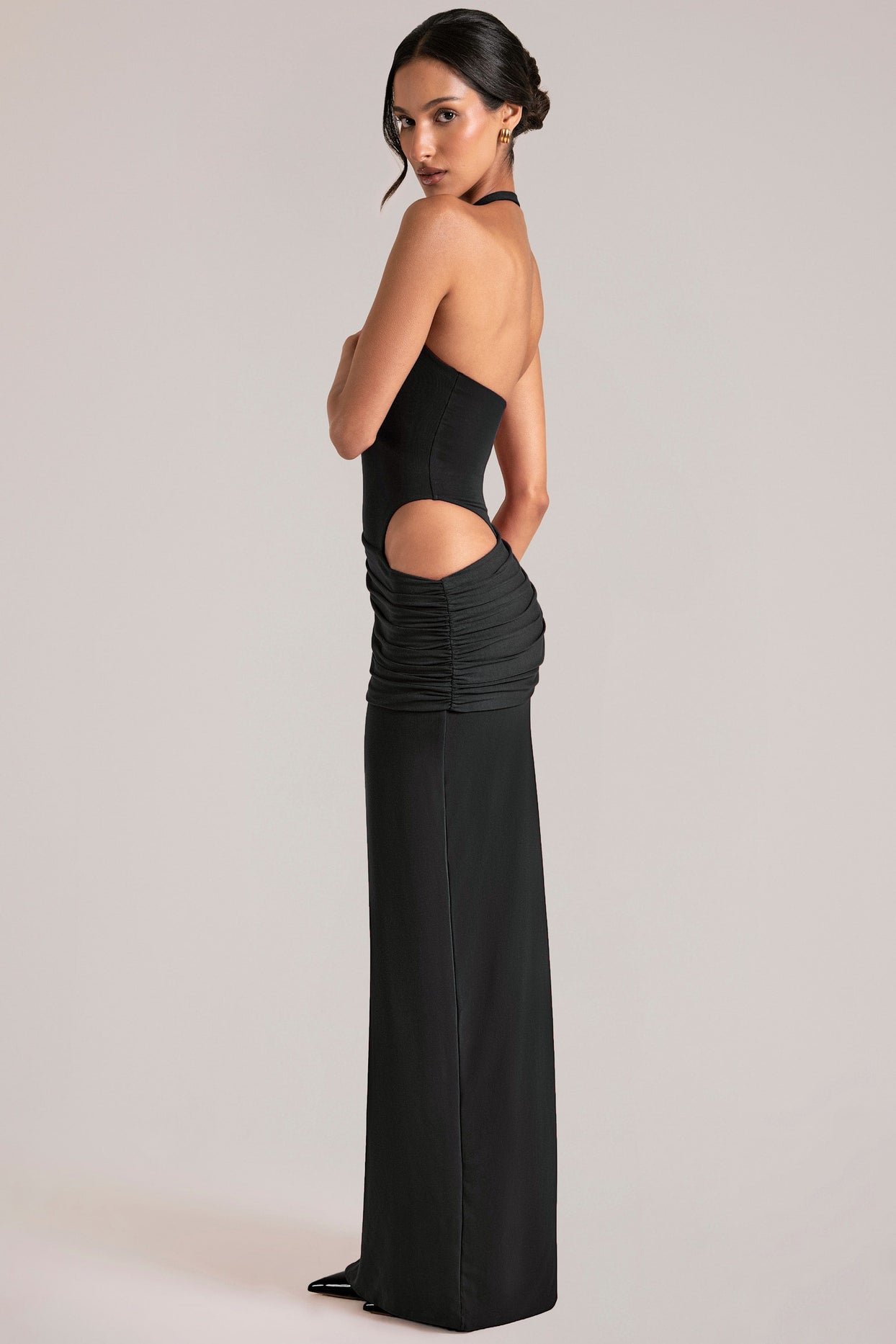 Oh Polly model Yasmin wearing the Oona Maxi Dress in Black Modal fabric perfect for wedding guest style
