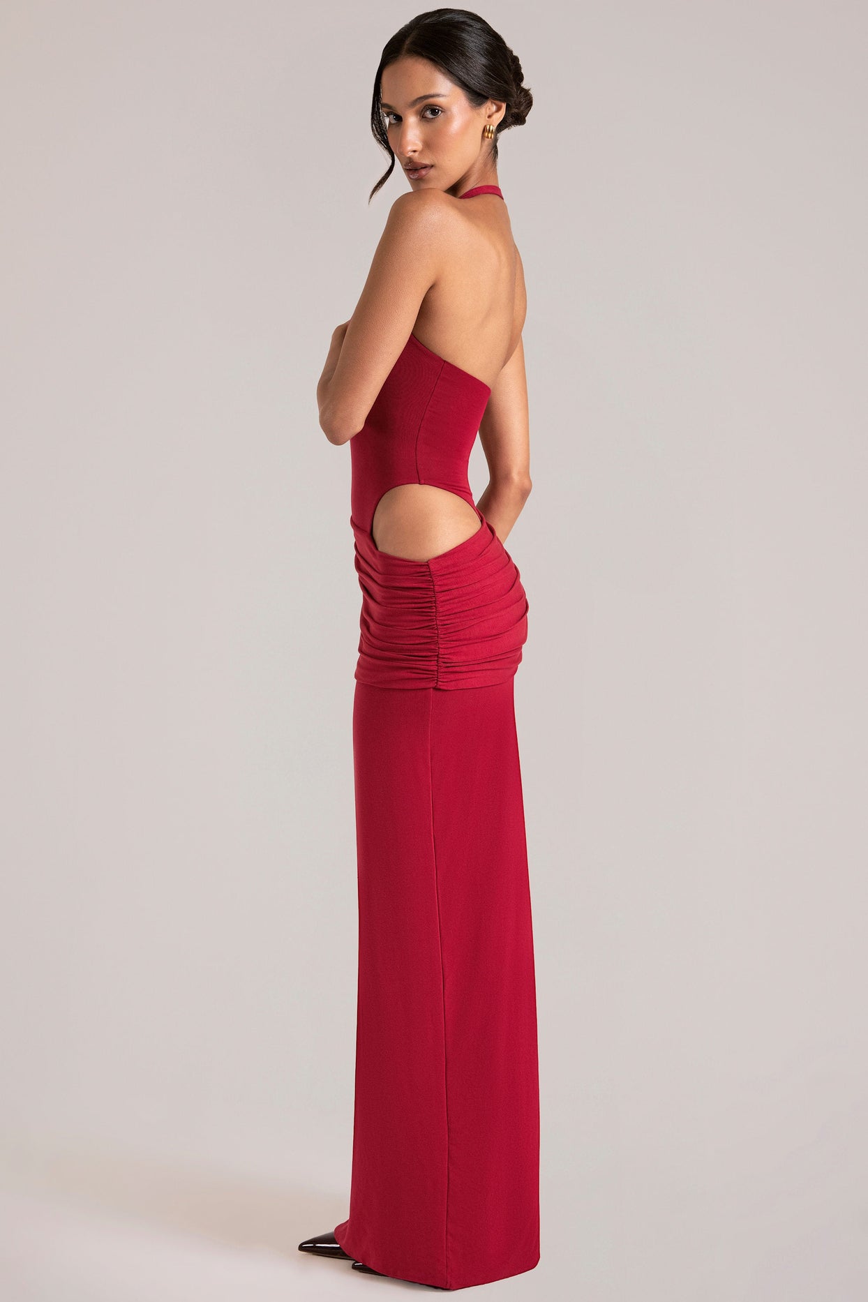 Oh Polly model Yasmin wearing the Oona Maxi Dress in Cherry Red Modal fabric perfect for rooftop gatherings