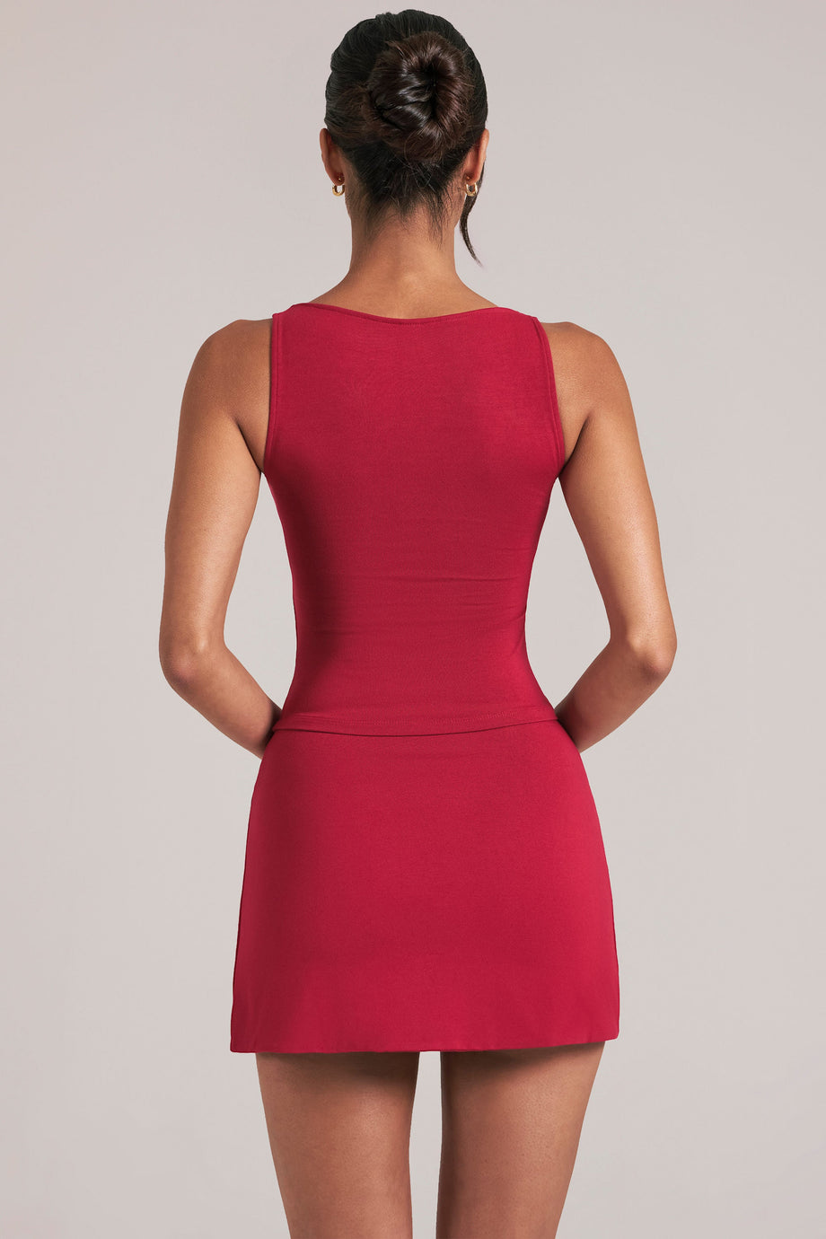 Oh Polly model Yasmin wearing the Veya Tops in Cherry Red Soft Jersey fabric perfect for brunch with friends