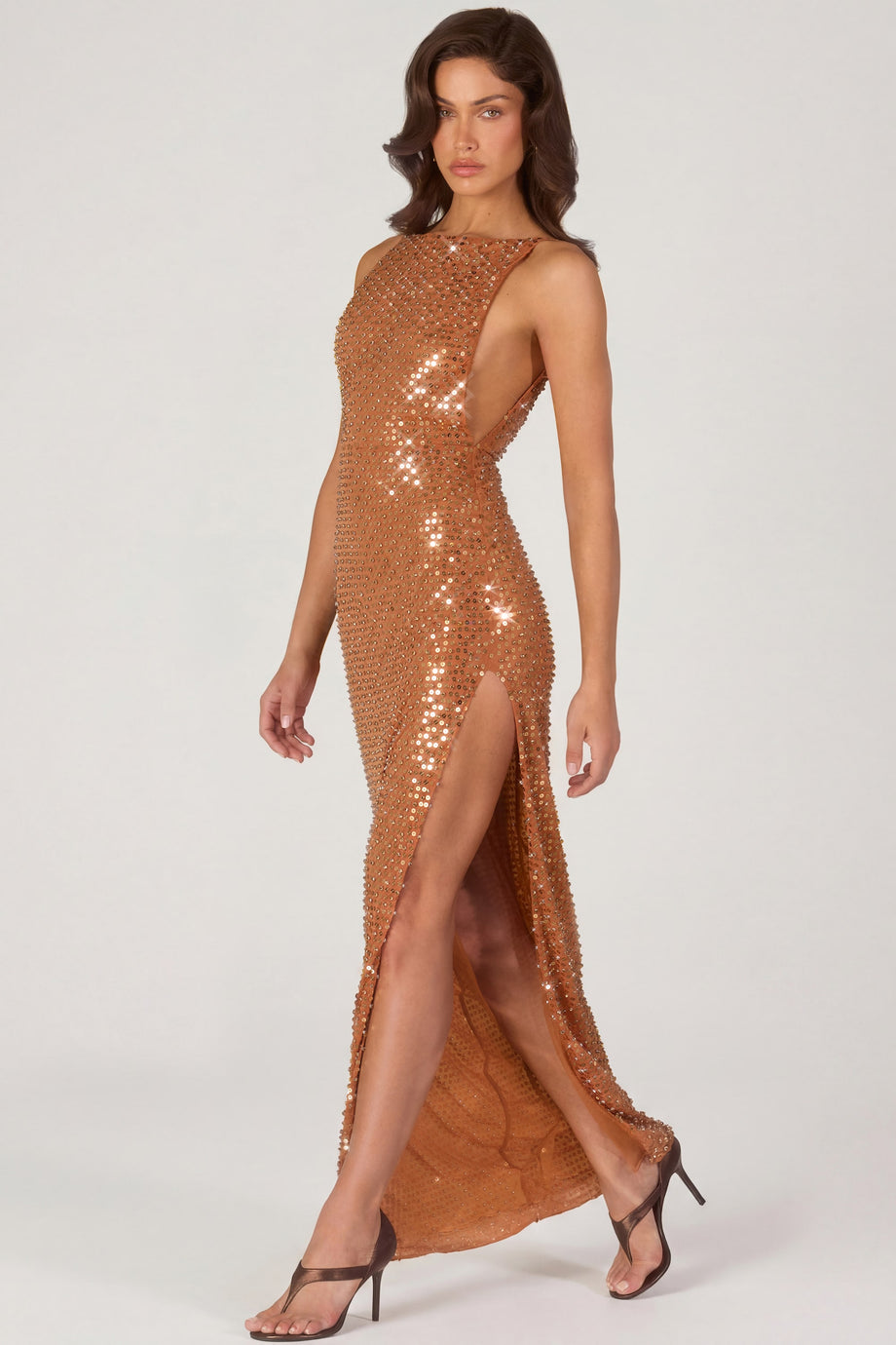 Oh Polly's Michelle Ivana wearing the Alyssia Maxi Dress in Bronze fabric perfect for holiday celebrations
