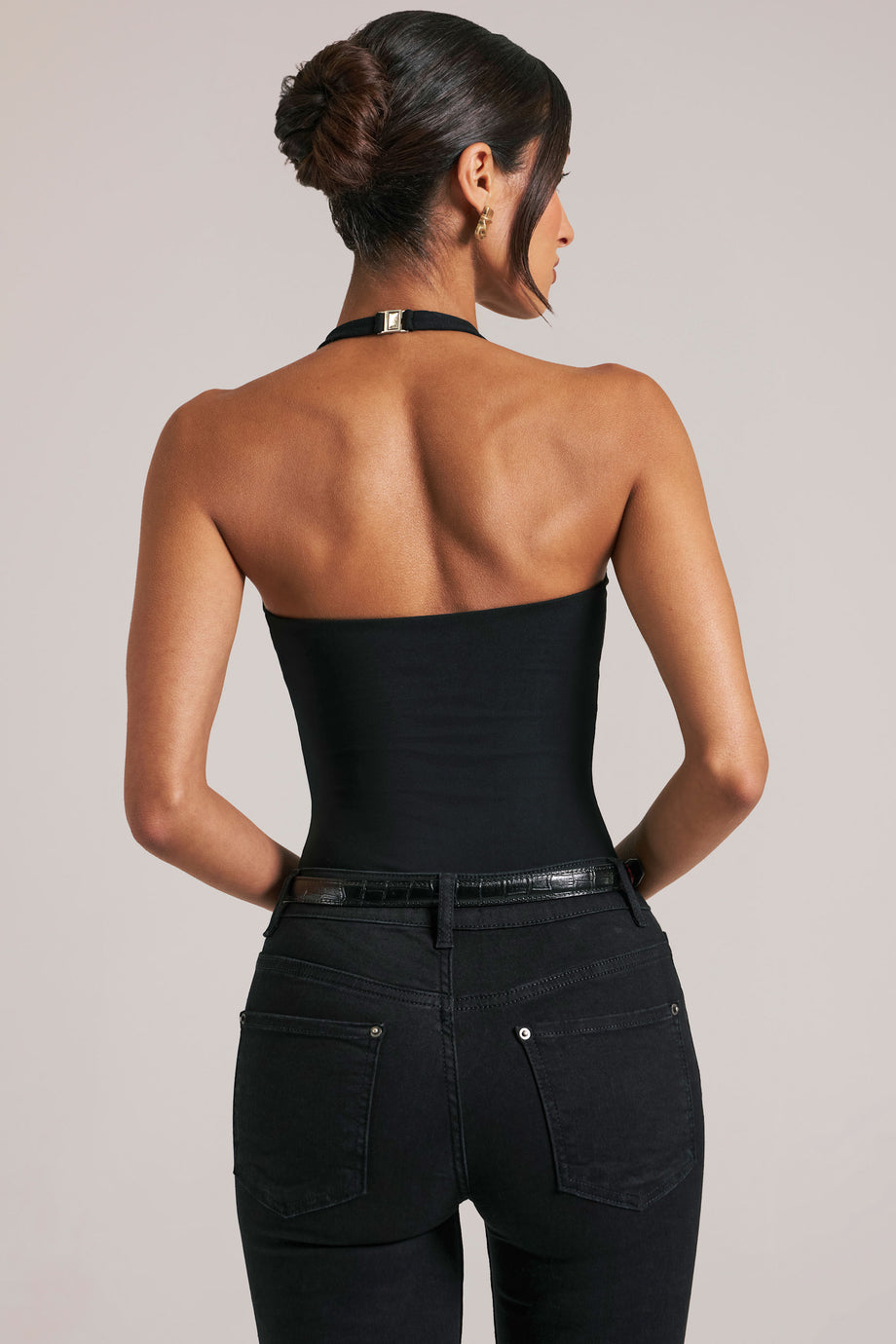 Oh Polly model Yasmin wearing the Rumi Bodysuit in Black Modal fabric perfect for evening events