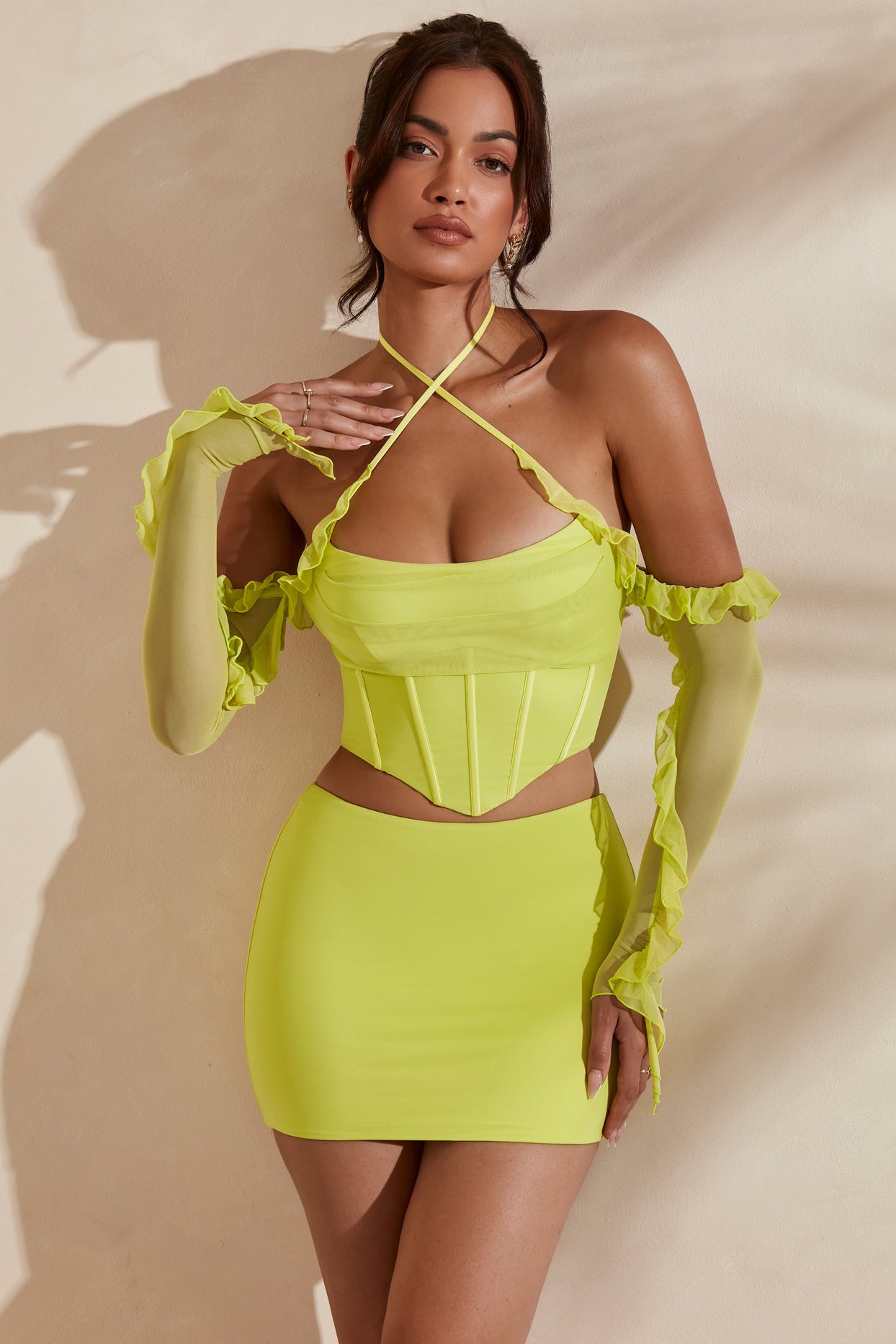 Full view of crop top in lime with matching bodycon skirt