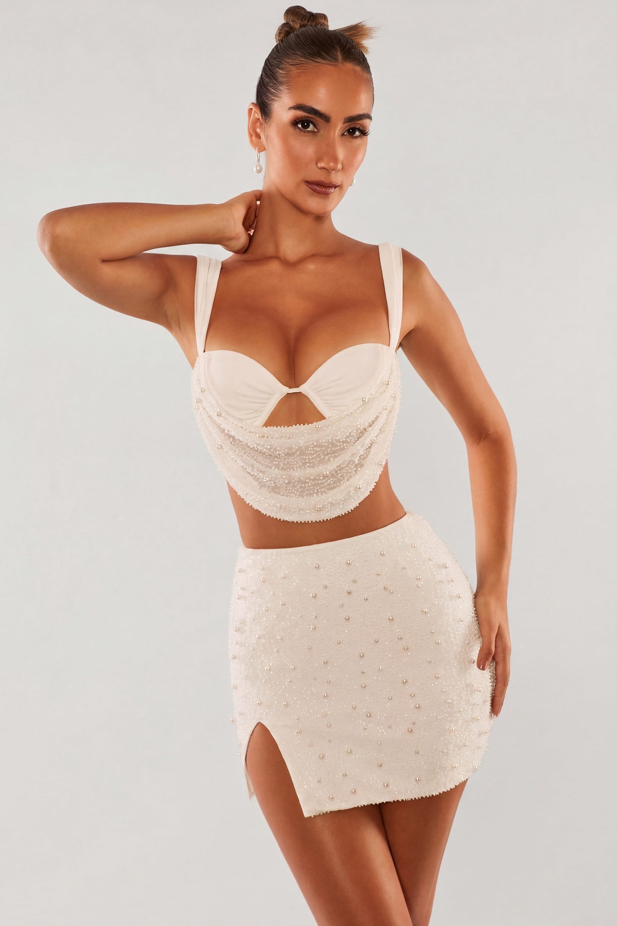 Oh Polly's Sierra Skye wearing the Belle Ile Mini Skirt in White Embellished fabric perfect for holiday events