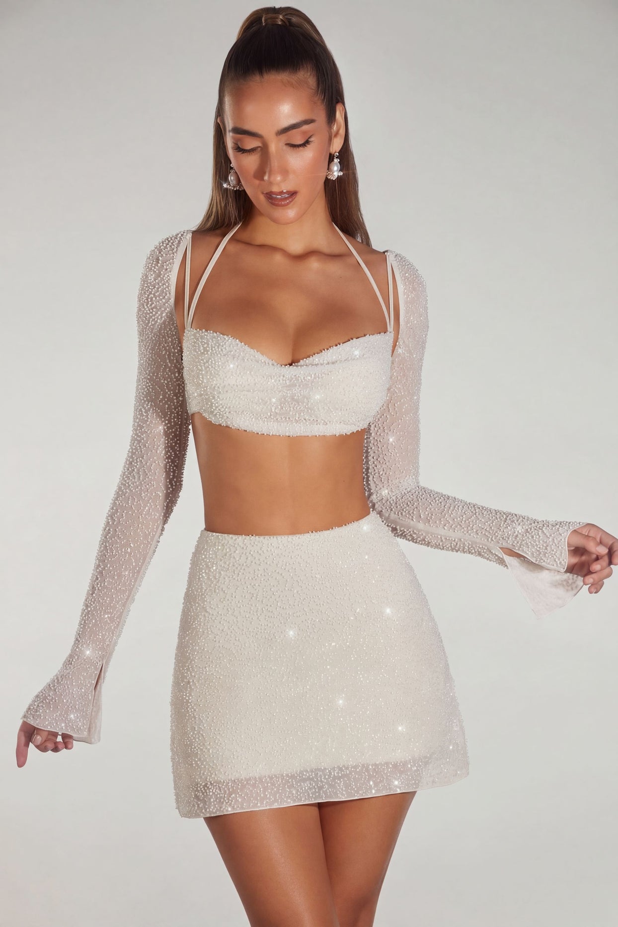 Oh Polly's Priscilla wearing the Lucerne Crop Top in Ivory Embellished fabric perfect for elegant evening events