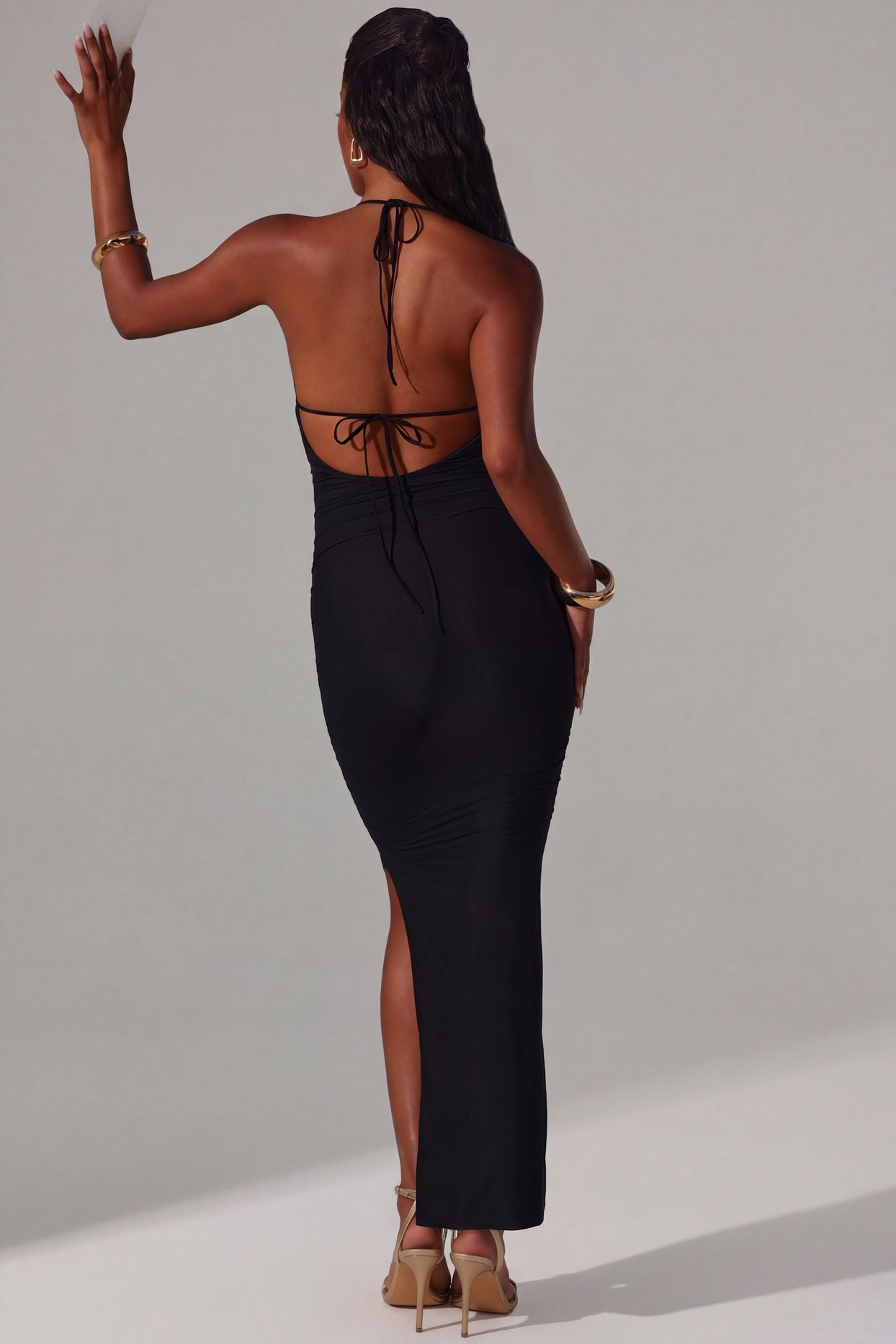 Oh Polly's Yarelis wearing the Mariposa Maxi Dress in Black Mesh fabric perfect for elegant evening events