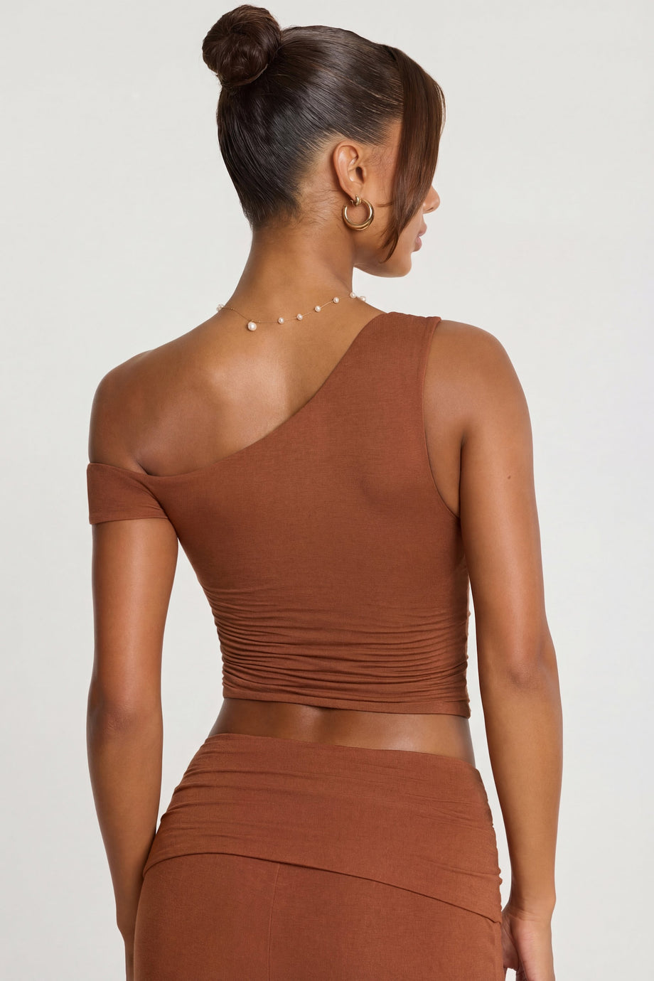 Oh Polly's Kiele wearing the Anona Regular Trousers in Chestnut Brown Modal fabric perfect for office chic looks