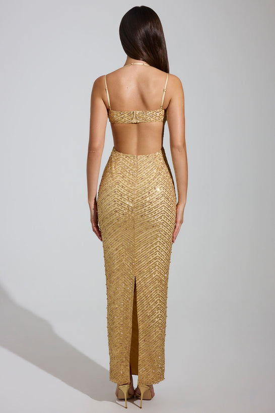 فستان ماكسي مزين بفتحة رقبة واسعة باللون الذهبي