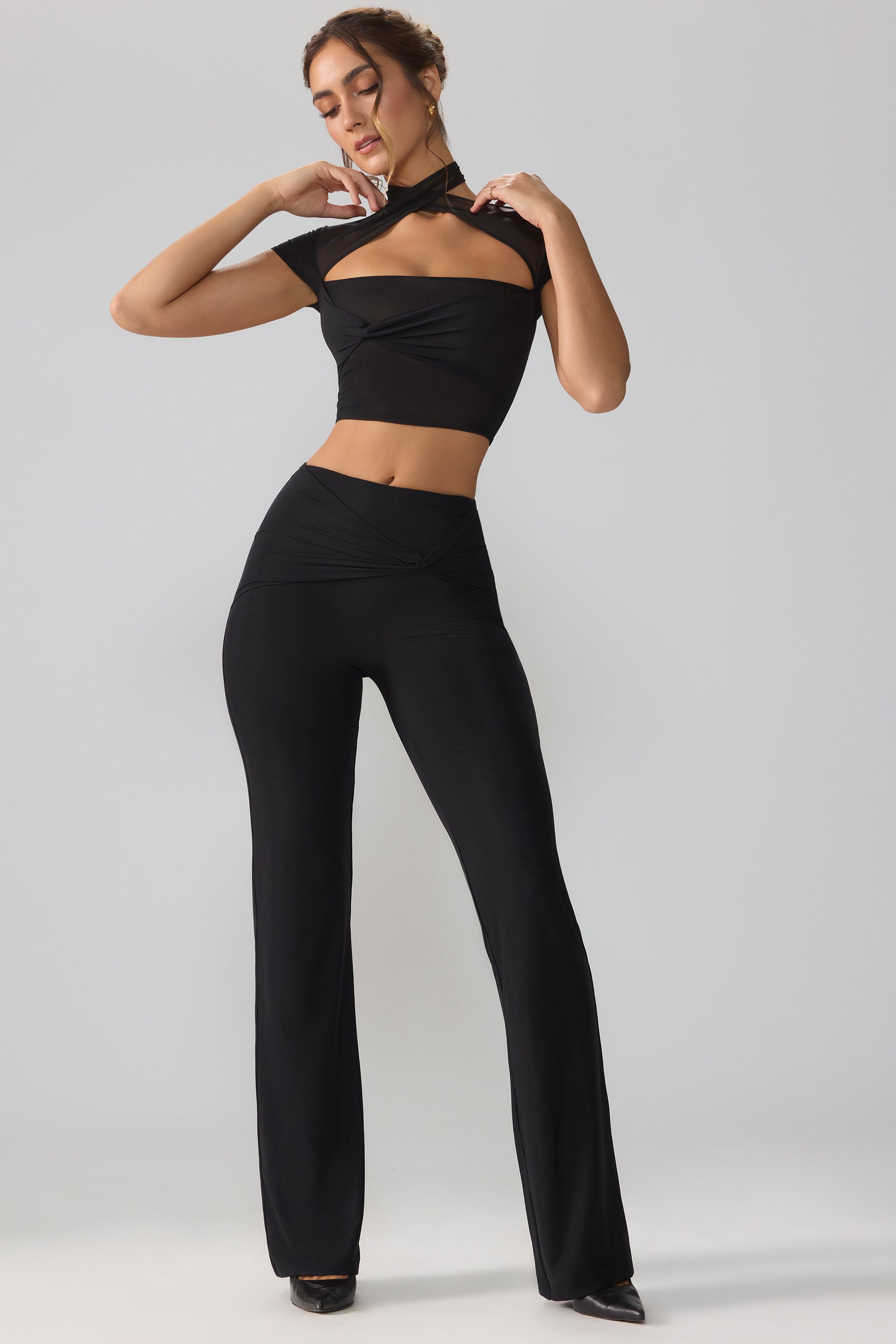 Ridley Mesh Mid Rise Twist Overlay Flare Trousers in Black Oh Polly