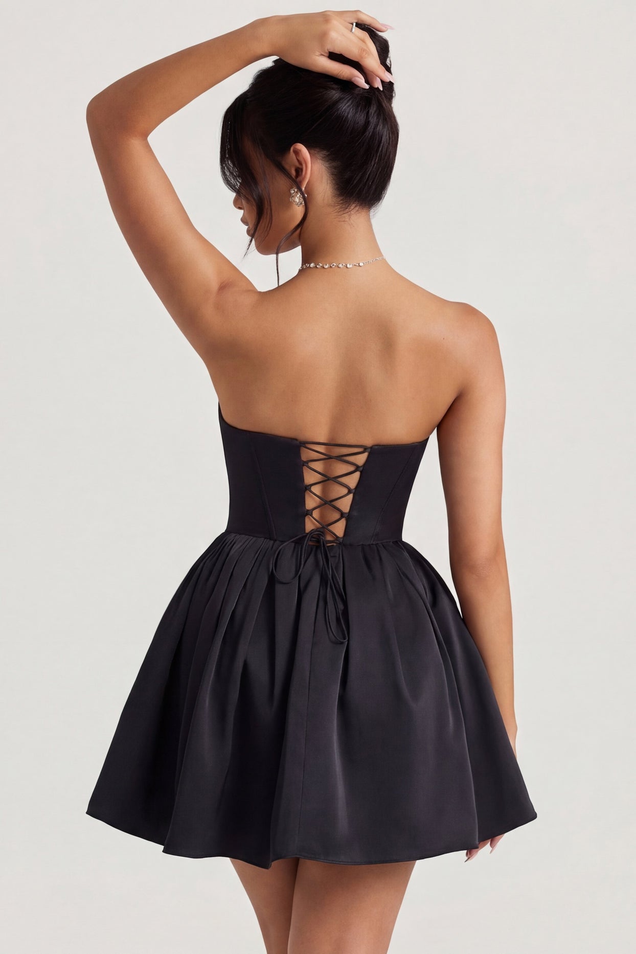 Oh Polly's Rona wearing the Emeline Mini Dress in Jet Black Tulle fabric perfect for date nights