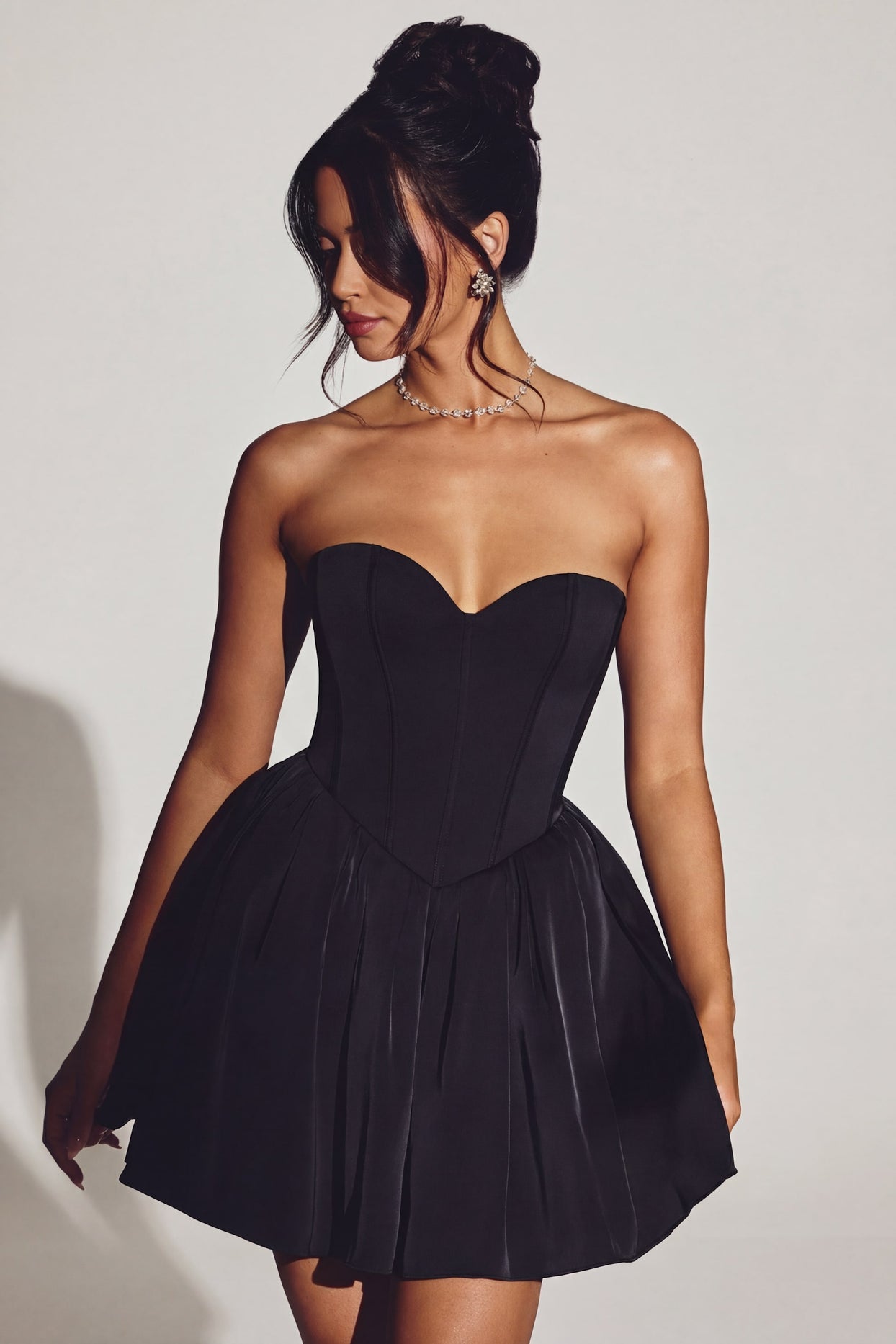 Oh Polly's Rona wearing the Emeline Mini Dress in Jet Black Tulle fabric perfect for cocktail parties