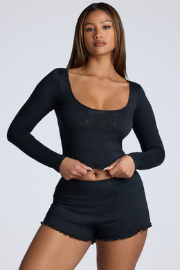 Long Sleeve Scoop Neck Pointelle Crop Top in Black