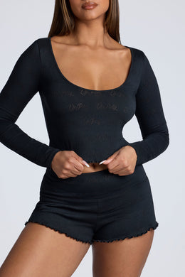 Long Sleeve Scoop Neck Pointelle Crop Top in Black