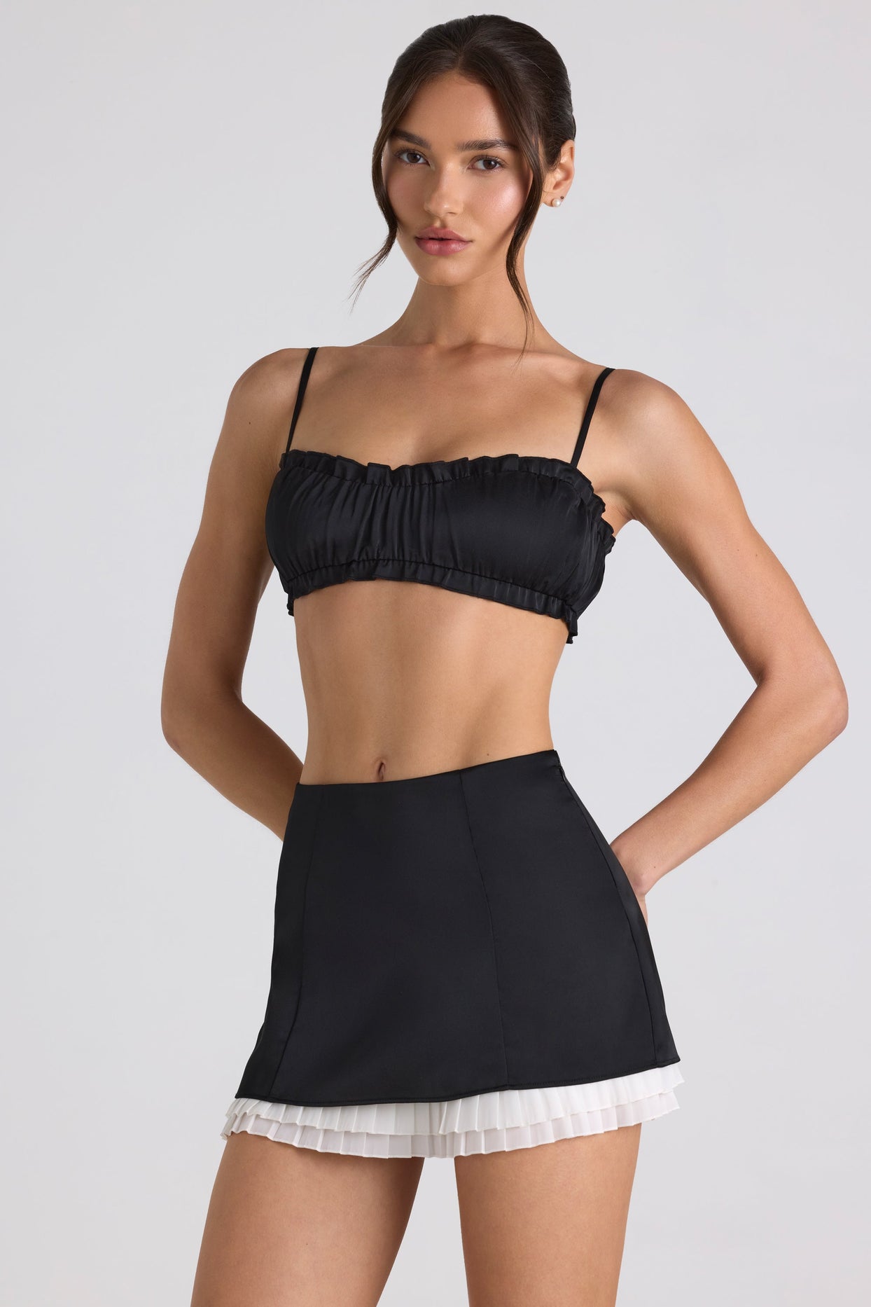 Ruffle-Trim Smocked Crop Top in Black