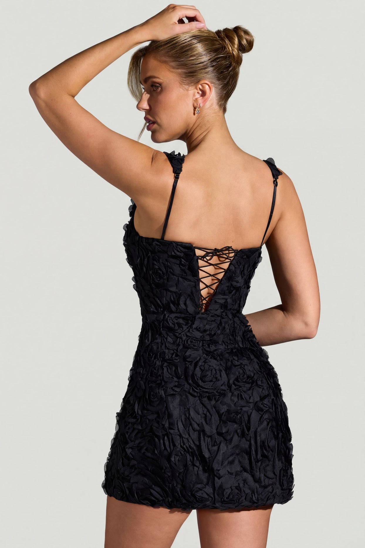 Oh Polly model Kara wearing the Posy Mini Dress in Black Tulle fabric perfect for a night out