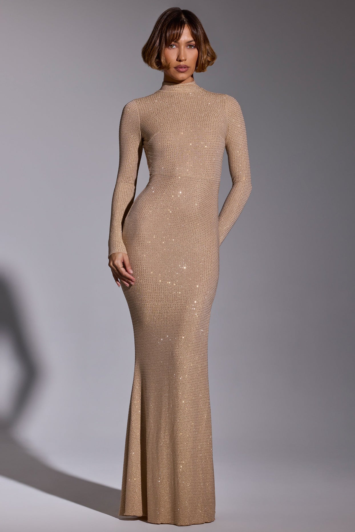 Celestia Embellished High Neck Long Sleeve Evening Gown in Gold Oh Polly AE Celestia Embellished High Neck Long Sleeve Evening Gown in Gold Oh Polly AE