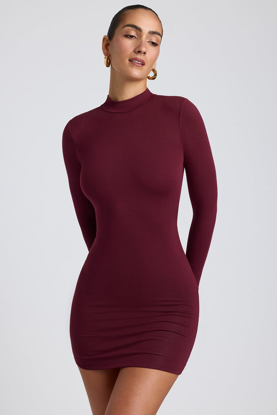 Yara Open-Back Long-Sleeve Mini Dress in Plum | Oh Polly Yara Open-Back Long-Sleeve Mini Dress in Plum | Oh Polly