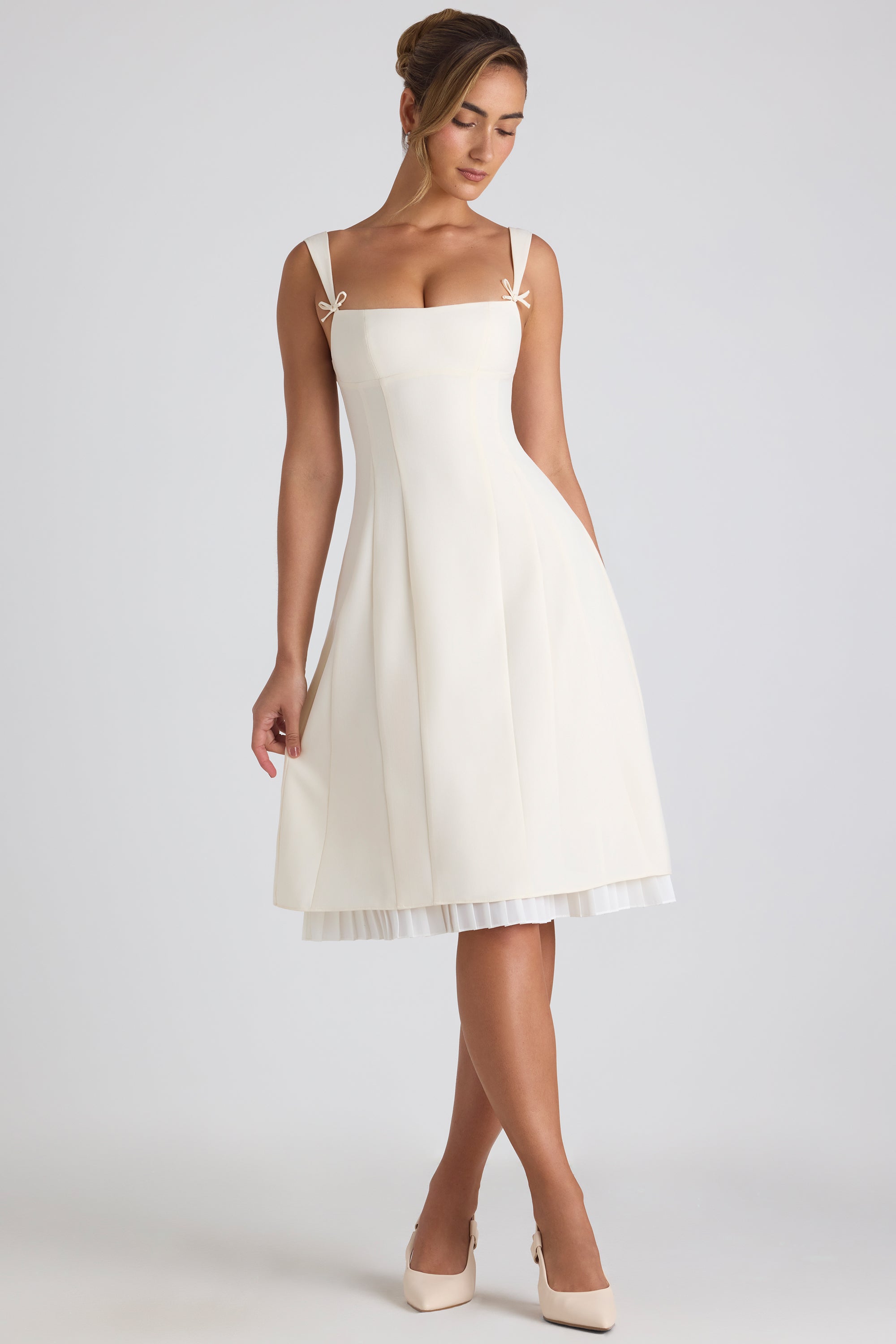 Isadora Bow Embellished Pleated A Line Midi Dress in Ivory Oh Polly