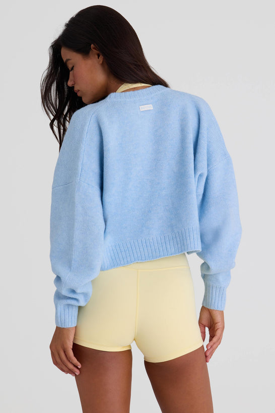 Bo+Tee model Nikki wearing the Christmas Knits Cardigan in Powder Blue Knitwear fabric perfect for festive office parties
