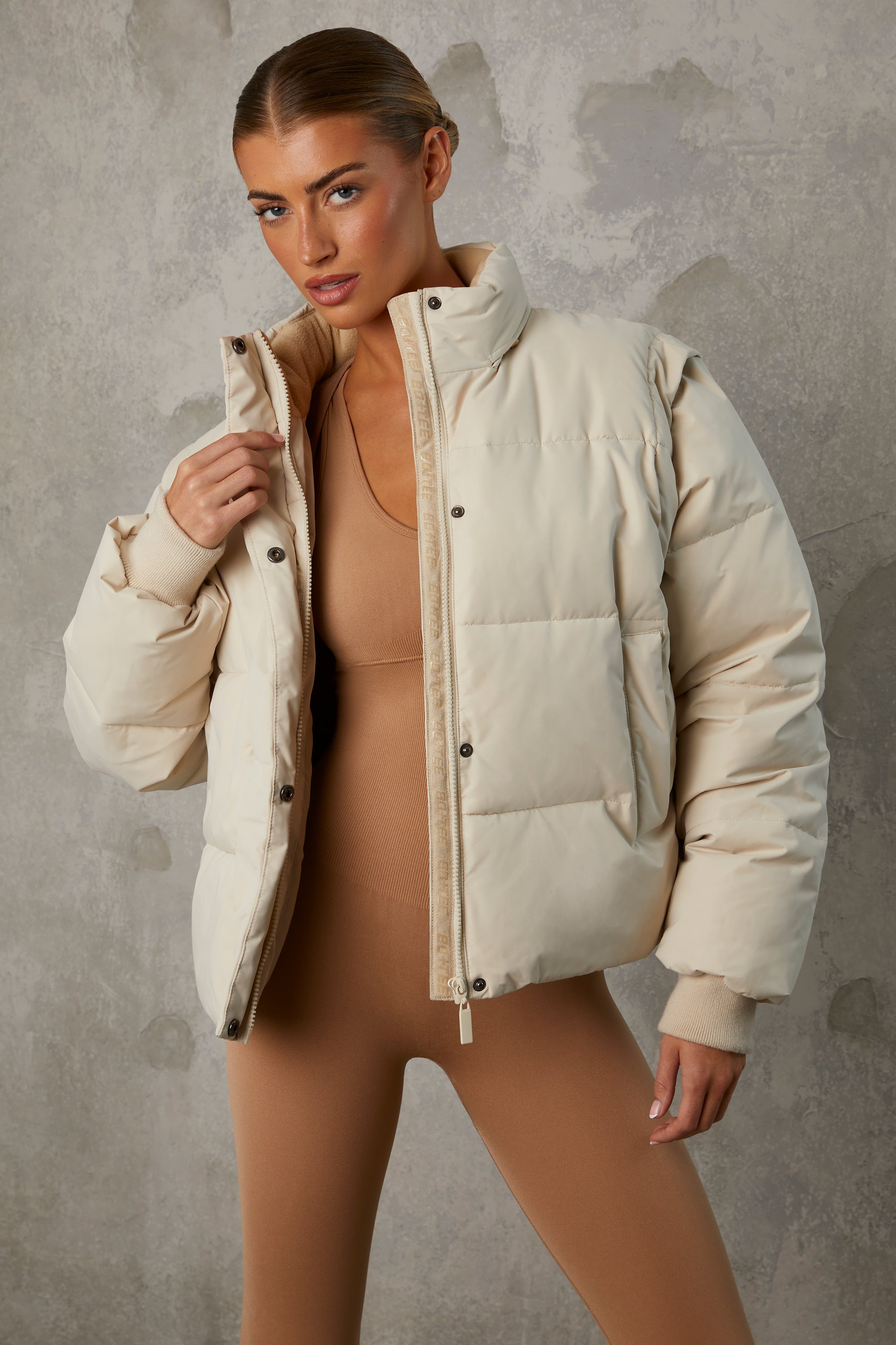 Essential Cropped Puffer Jacket with Detachable Sleeves in Sand Oh Polly