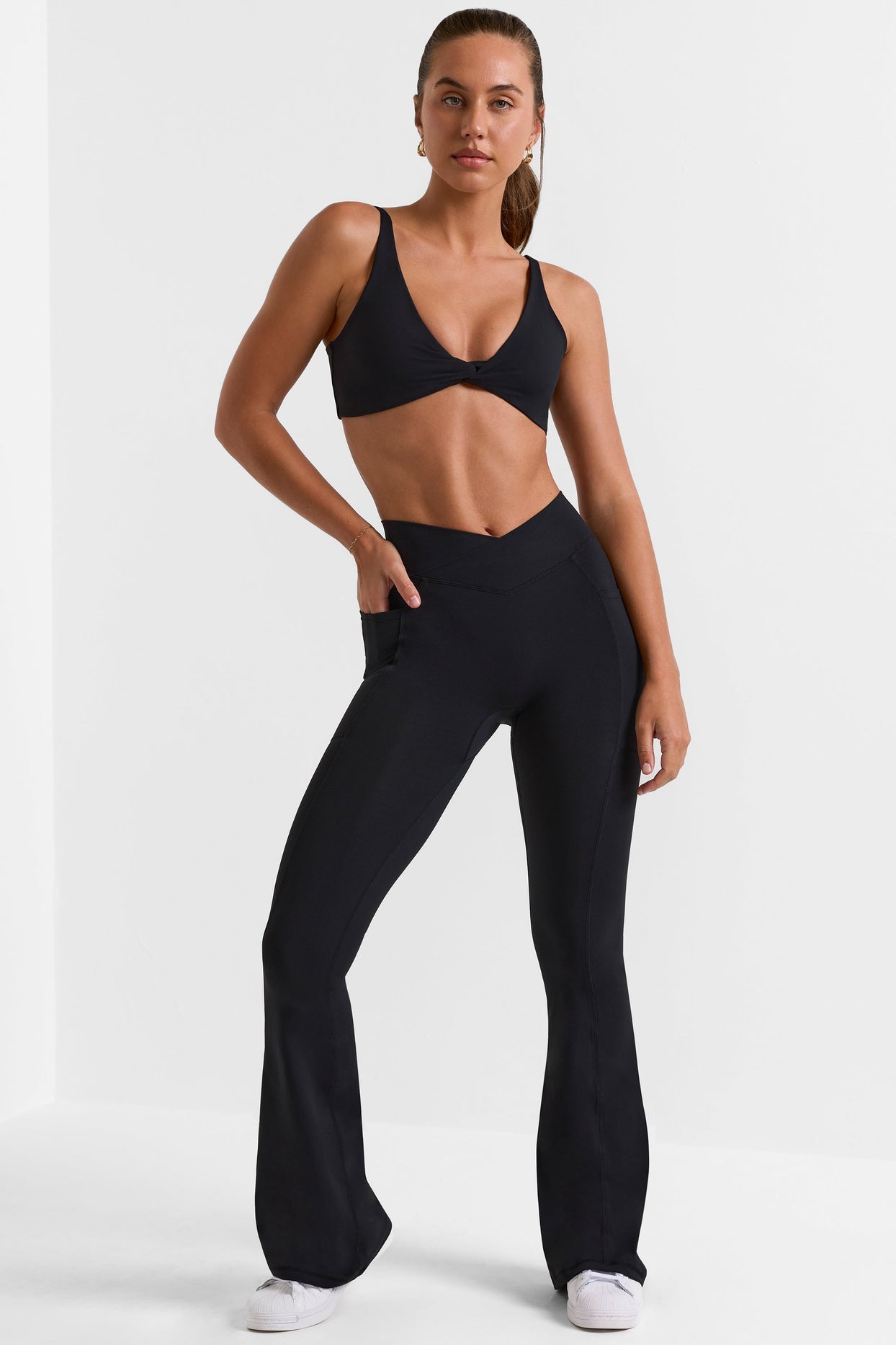 Match Cross Waistband Flare Pocket Leggings in Black | Oh Polly